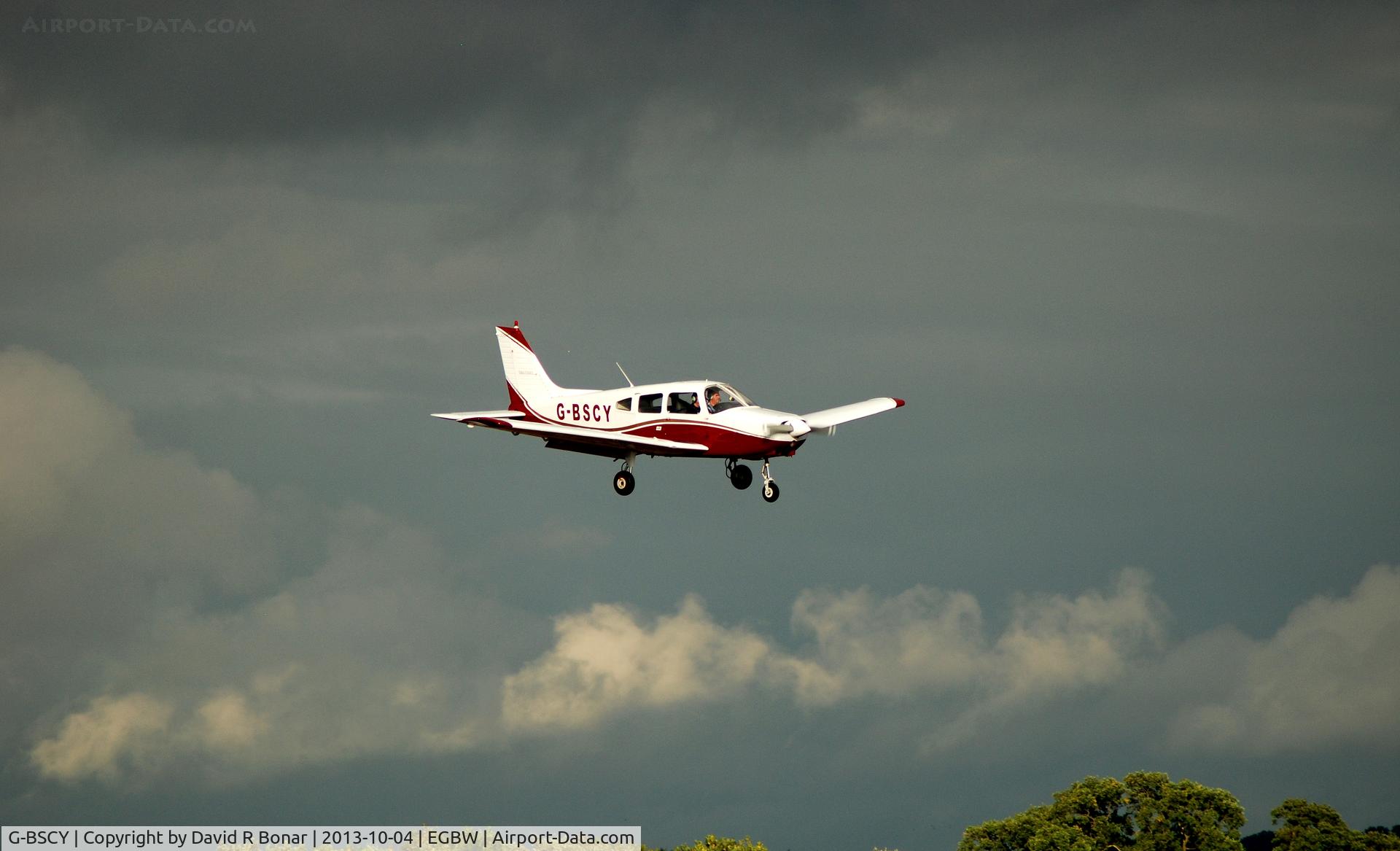 G-BSCY, 1975 Piper PA-28-151 Cherokee Warrior C/N 28-7515046, Running ahead of a threatening sky