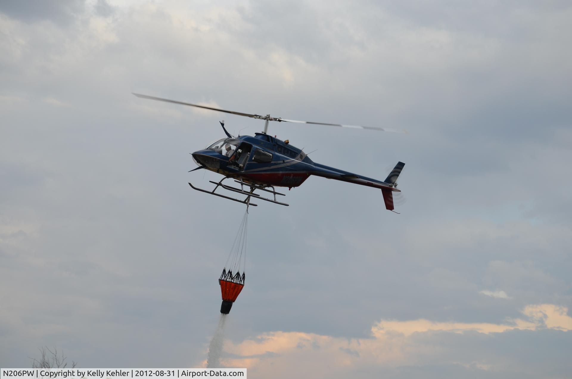 N206PW, 1972 Bell OH-58A Kiowa C/N 42055, Almost have it out...  one last hit