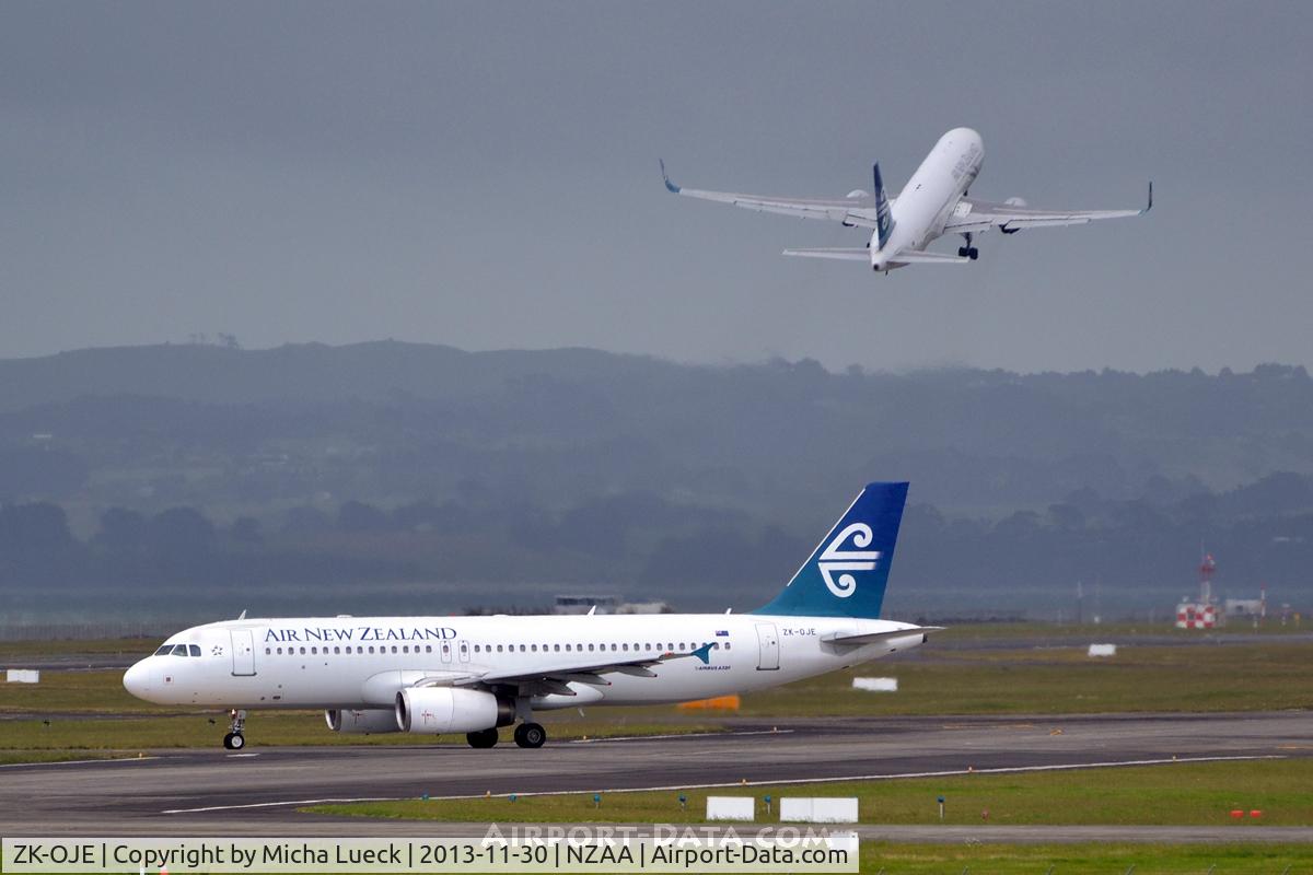 ZK-OJE, 2003 Airbus A320-232 C/N 2148, B 767-300 (ZK-NCJ) climbing out in the background