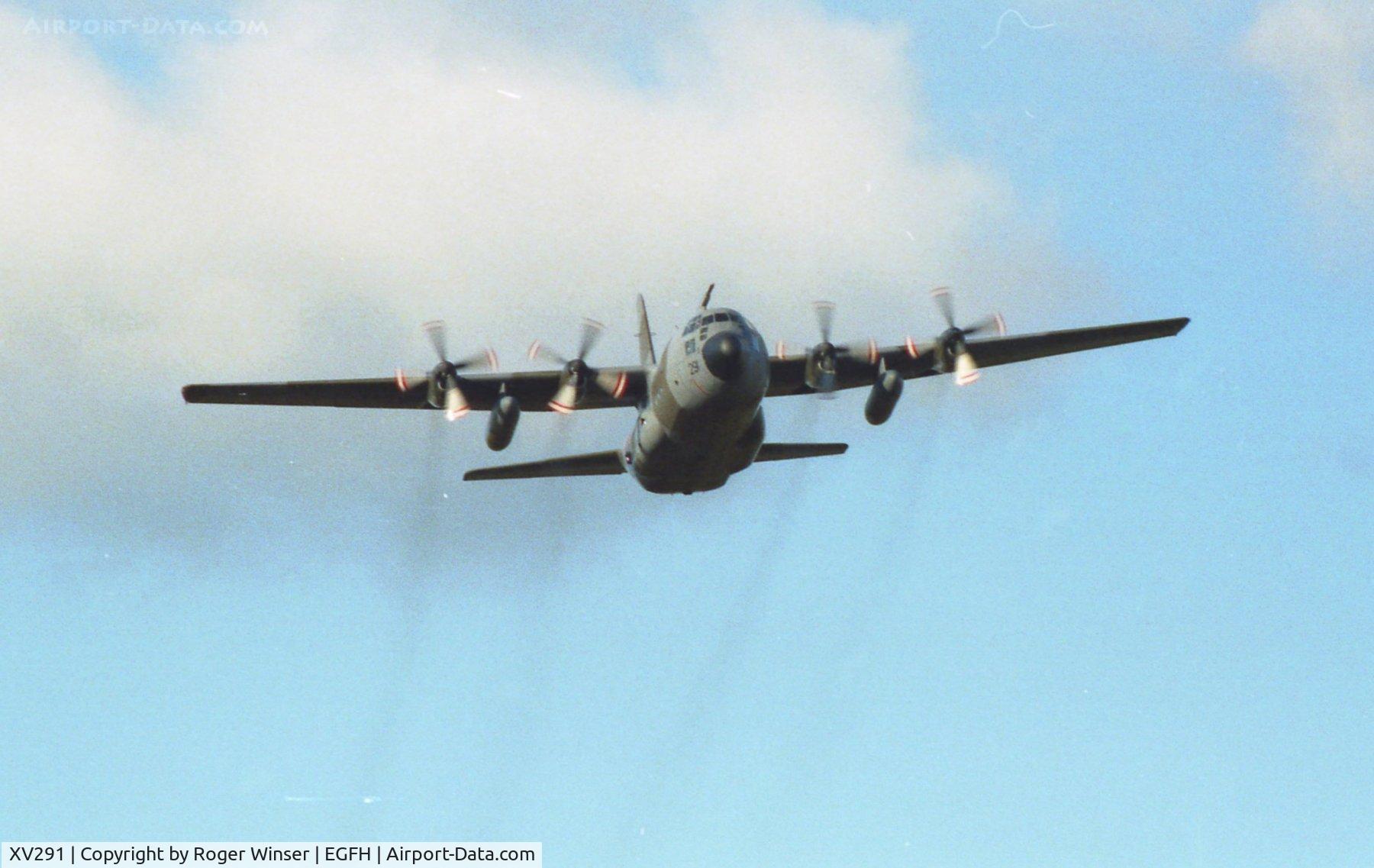 XV291, 1967 Lockheed C-130K Hercules C.1 C/N 382-4256, RAF Hercules C.1 from the Lyneham Transport Wing beats up the tower at Swansea Airport. Date estimated as the mid 1990's.