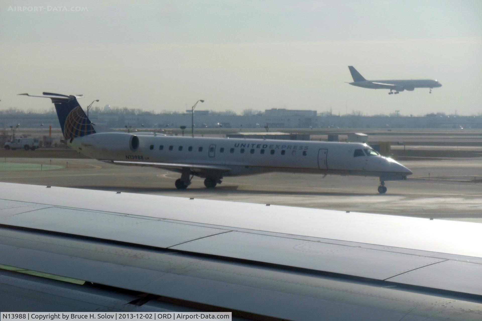 N13988, 2000 Embraer ERJ-145LR (EMB-145LR) C/N 145265, seen from the window of my plane at ORD