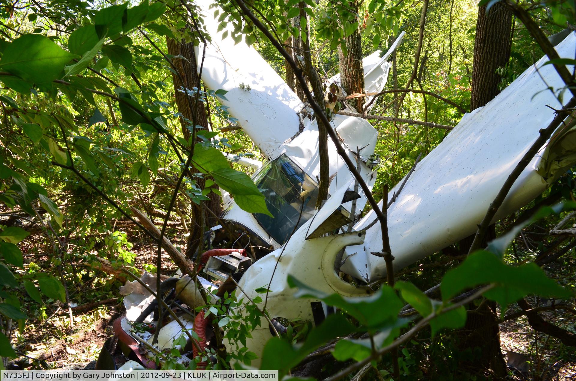 N735FJ, 1977 Cessna 182Q Skylane C/N 18265387, After engine stopped in flight - went down on 3R approach to KLUK 9:30 PM Sept. 22, 2012 near Ft. Thomas, Ky with 2 souls on board who walked away uninjured.