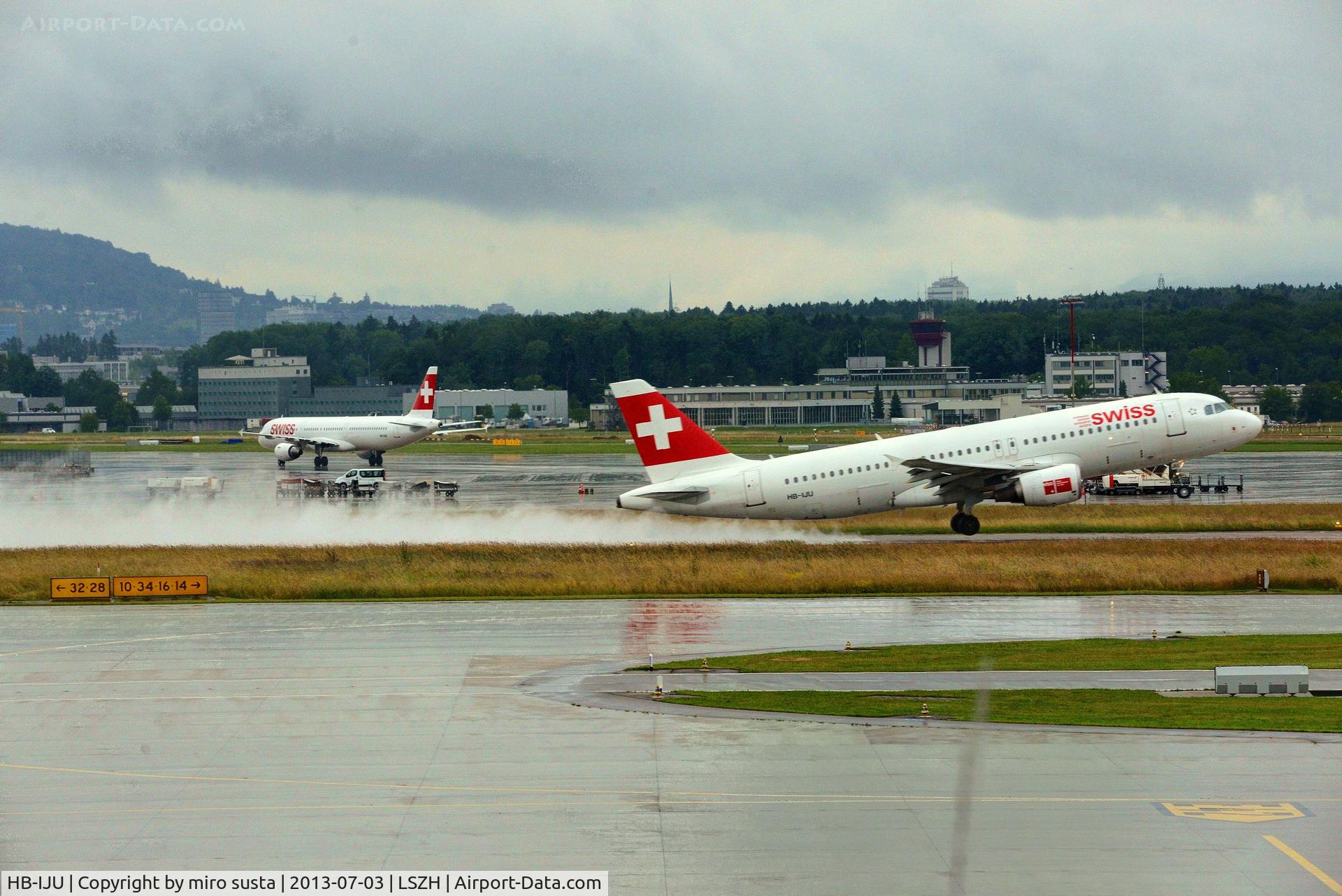 HB-IJU, 2003 Airbus A320-214 C/N 1951, Swiss Airbus A320-214 taking-off from Zurich-Kloten International Airport during rainy summer day.