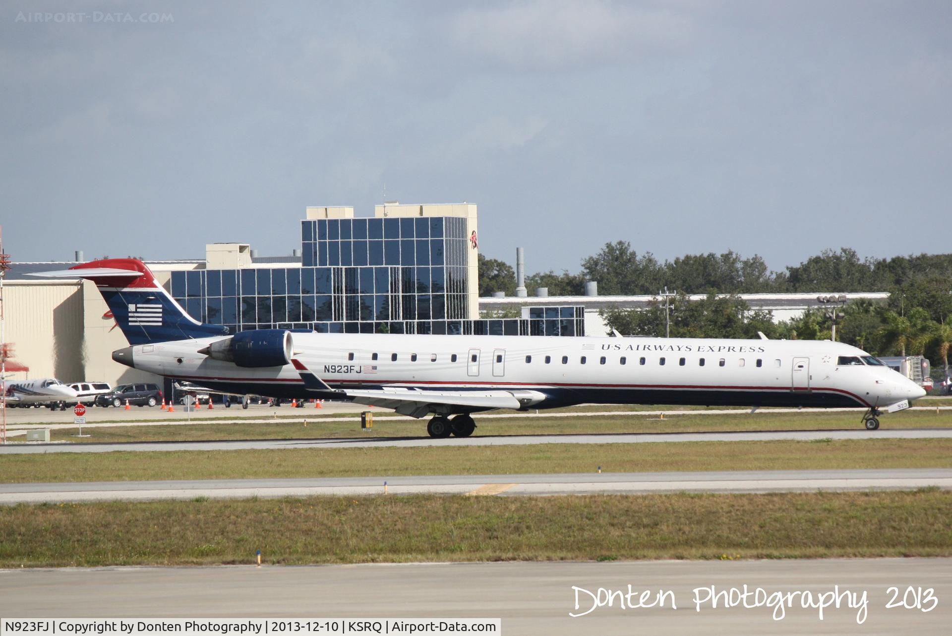 N923FJ, 2004 Bombardier CRJ-900ER (CL-600-2D24) C/N 15023, US Air Flight 2675 operated by Mesa (N923FJ) arrives at Sarasota-Bradenton International Airport following  flight from Charlotte-Douglas International Airport