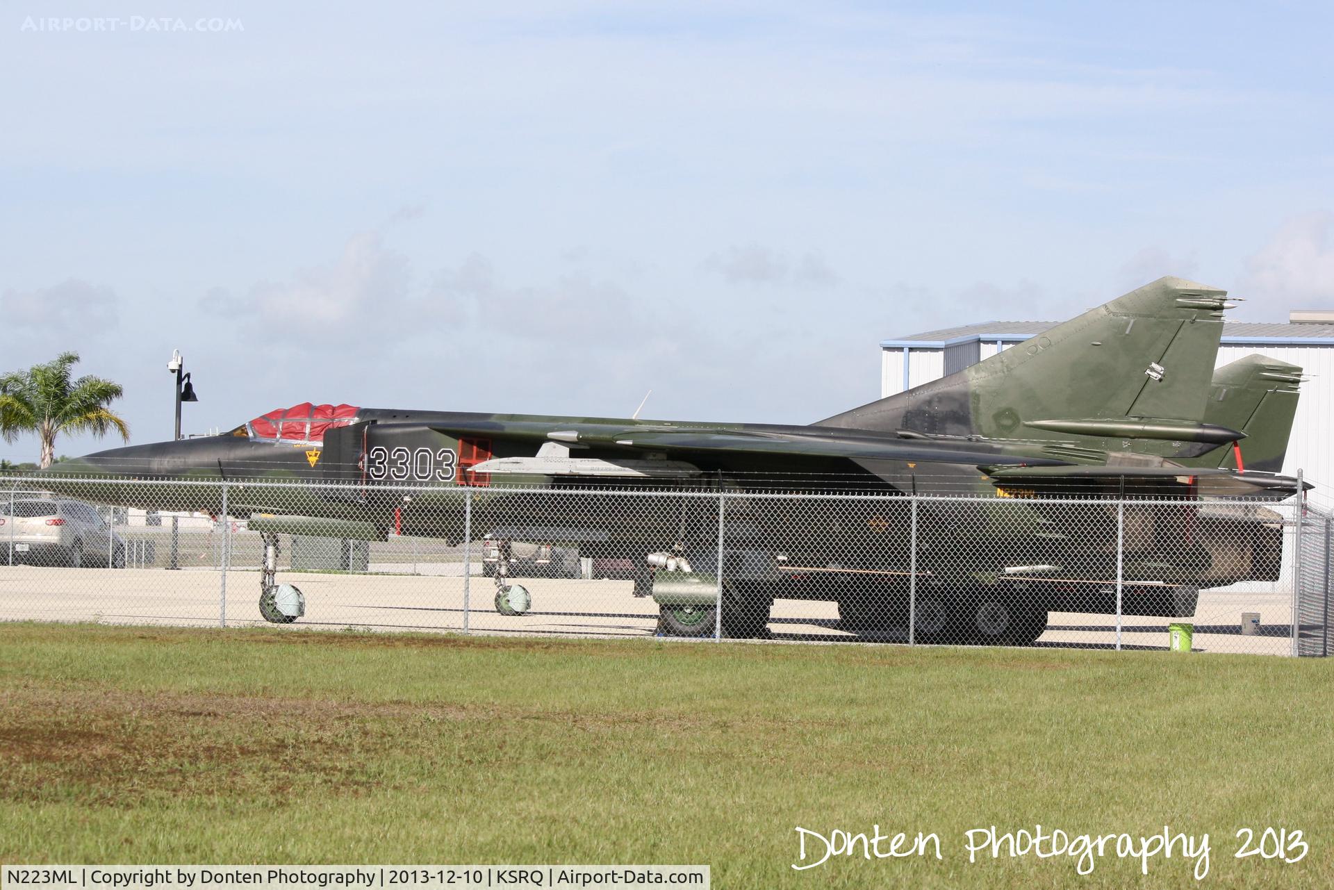 N223ML, 1981 Mikoyan-Gurevich MiG-23ML C/N 0390323303, Mig-23 (N223ML) sits on the ramp at SRQ