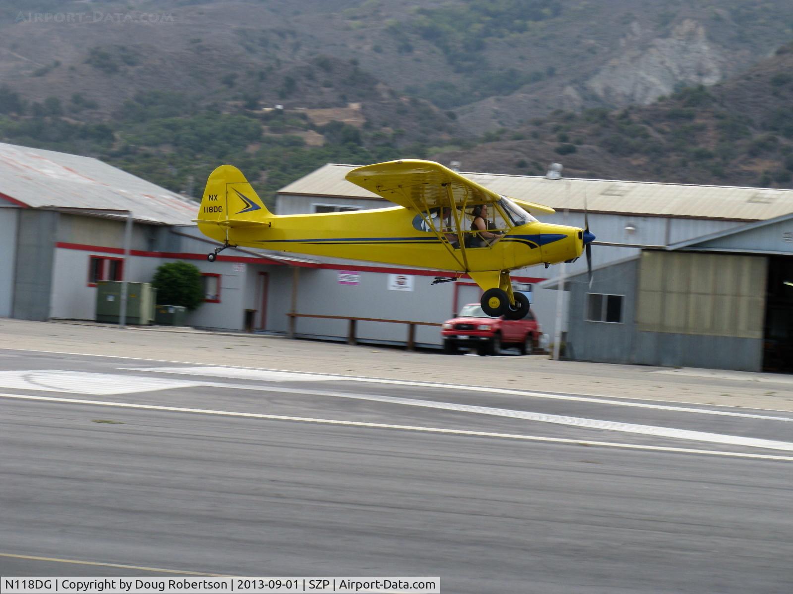 N118DG, 2008 Piper PA-18 Replica C/N 001, 2008 Ganzer XPA18, Continental O-200 100 Hp, another on final Rwy 22, grab shot