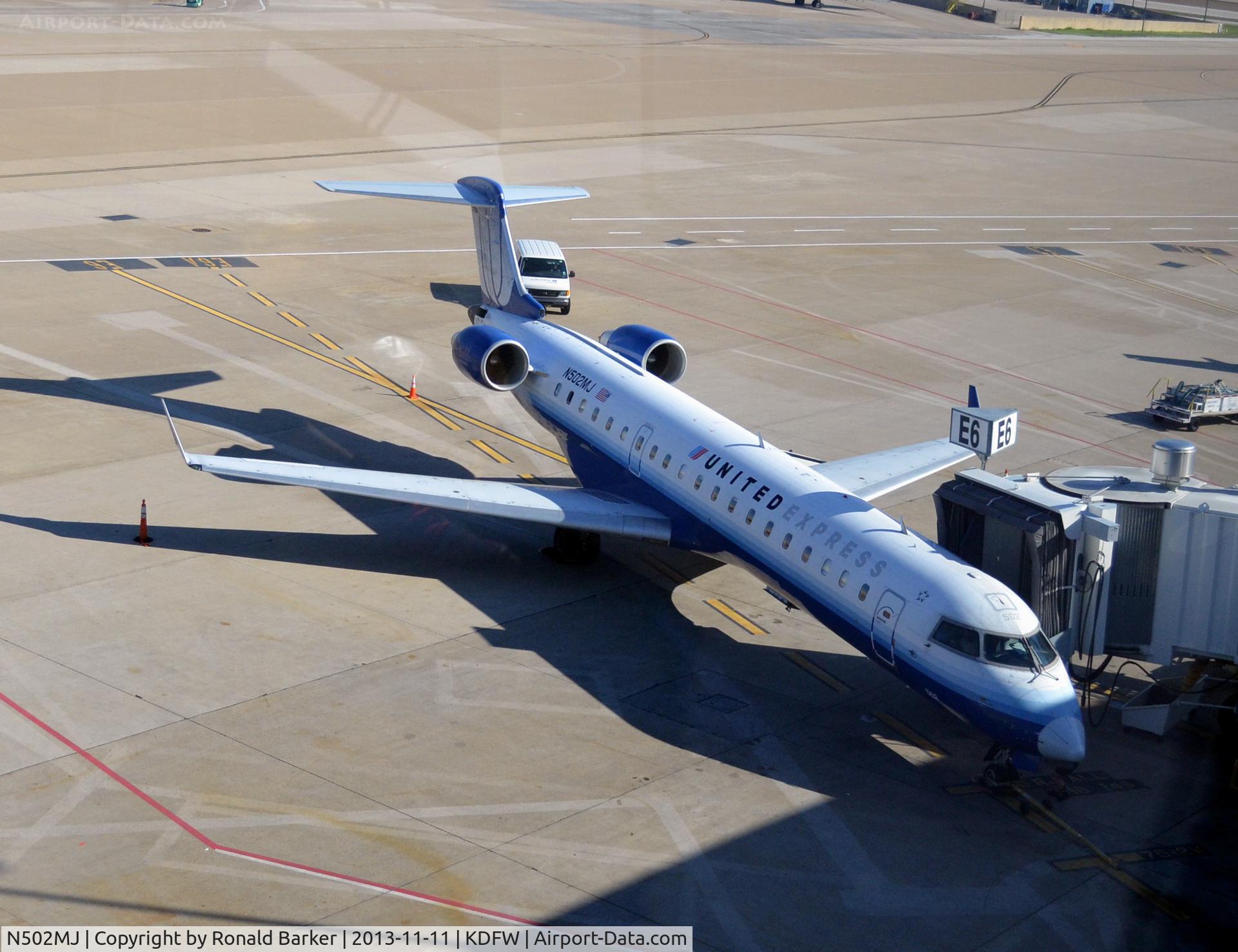 N502MJ, 2002 Bombardier CRJ-700 (CL-600-2C10) Regional Jet C/N 10050, Gate E6 DFW