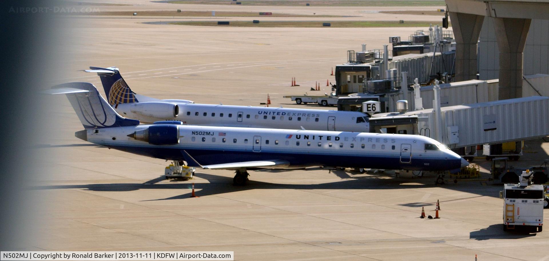 N502MJ, 2002 Bombardier CRJ-700 (CL-600-2C10) Regional Jet C/N 10050, Gate E6 DFW