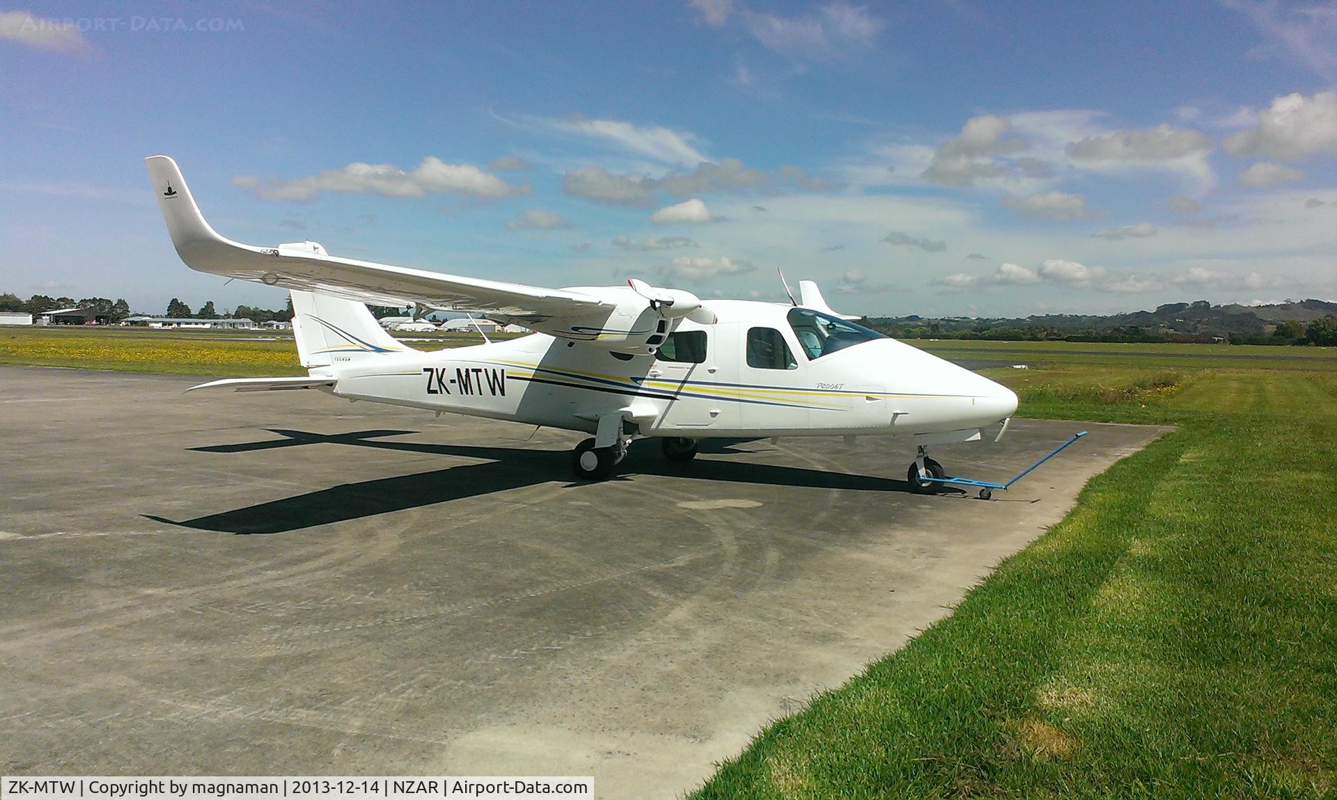ZK-MTW, 2011 Tecnam P-2006T C/N 065, Sunbathing at Ardmore outside tecnam hangar