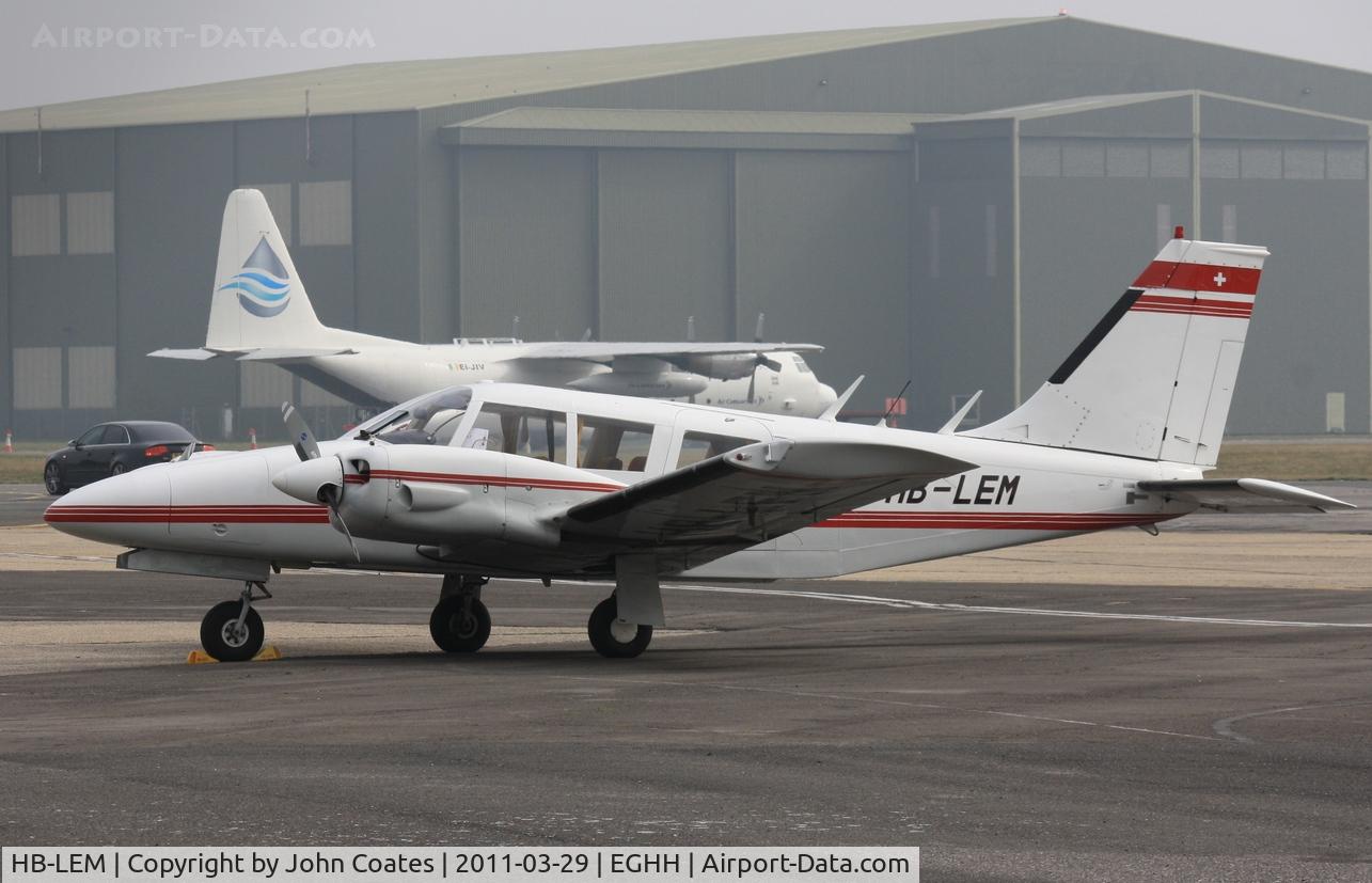 HB-LEM, 1973 Piper PA-34-200 Seneca C/N 34-7350327, Parked at BHL with Oil Spill Herc EI-JIV in background