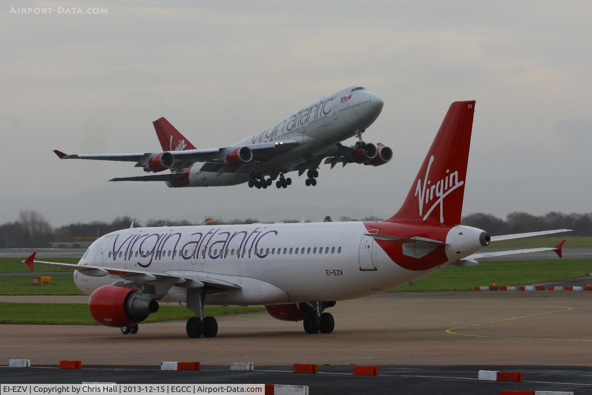 EI-EZV, 2003 Airbus A320-214 C/N 2001, with G-VAST departing in the background