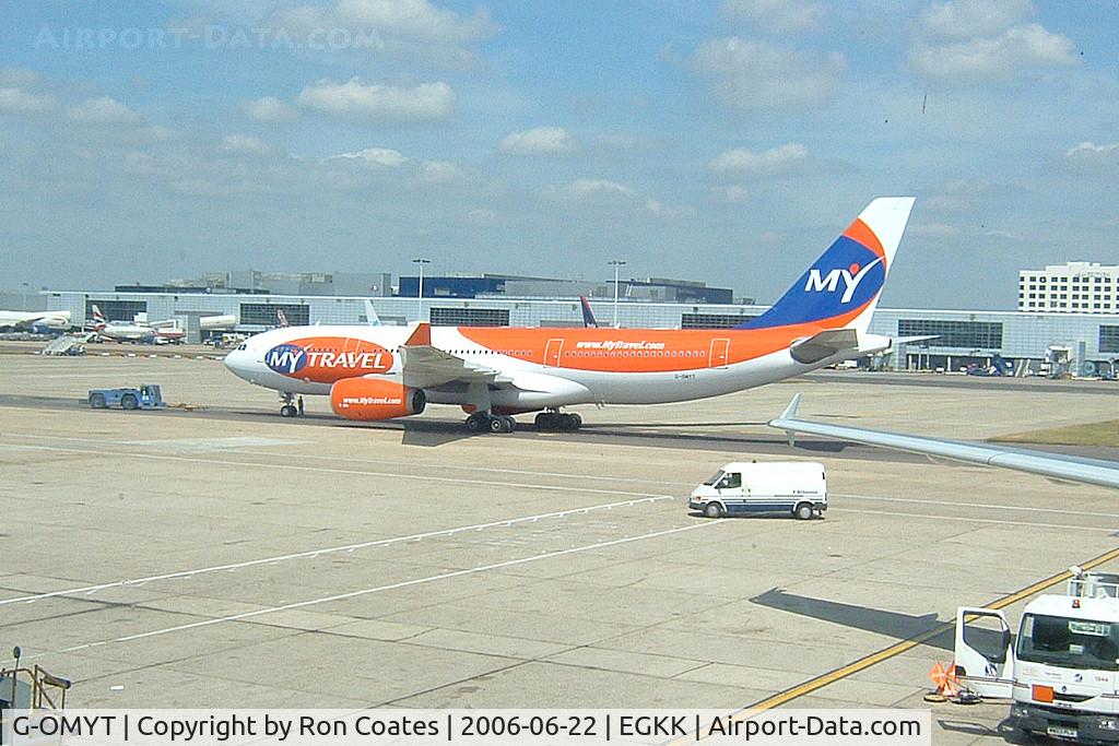 G-OMYT, 1999 Airbus A330-243 C/N 301, A My Travel Airways (now Thomas Cook) being towed from its gate at Gatwick Airport