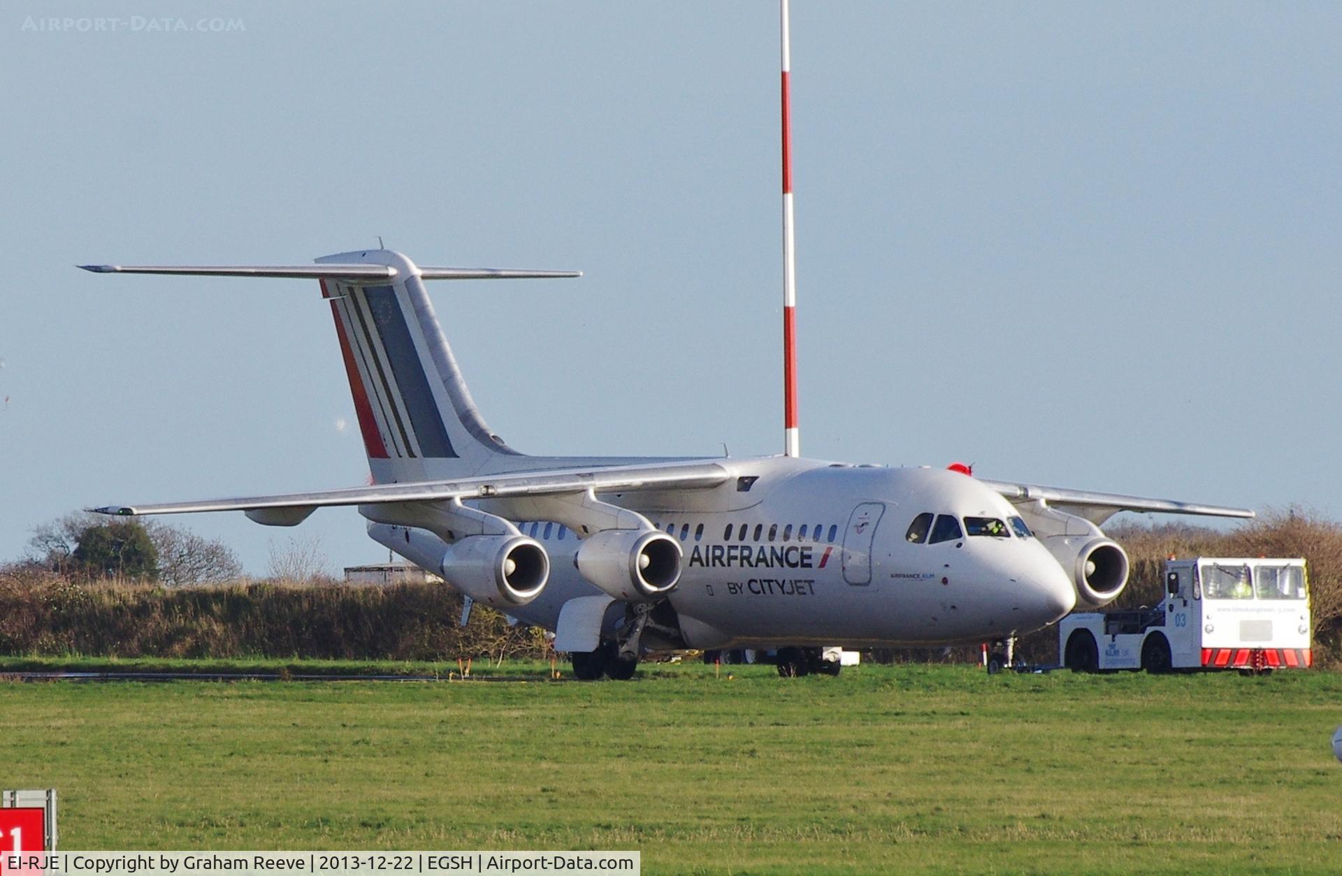 EI-RJE, 1998 BAE Systems Avro 146-RJ85 C/N E.2335, Under tow at Norwich.