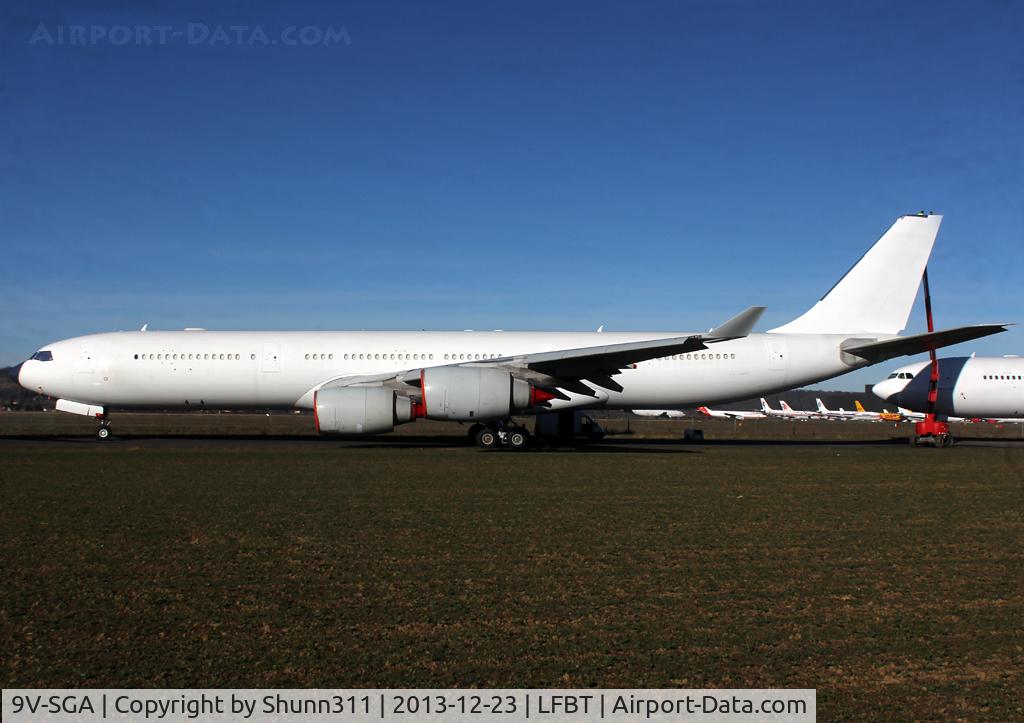 9V-SGA, 2003 Airbus A340-541 C/N 492, Stored in all white c/s without titles, grey engines and registration partially visible