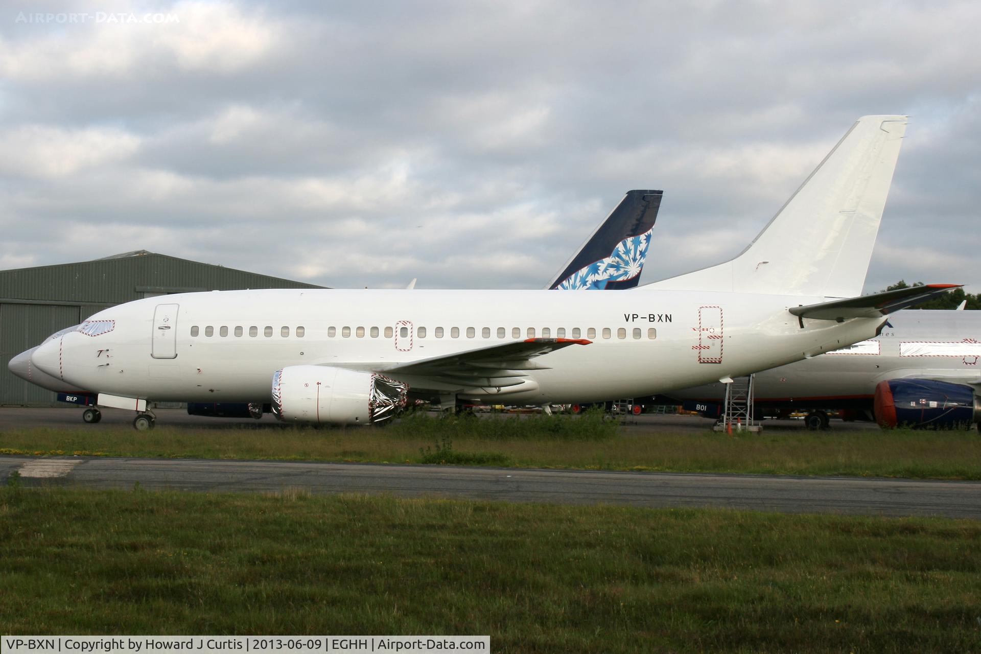 VP-BXN, 1990 Boeing 737-53A C/N 24754, Now all white.