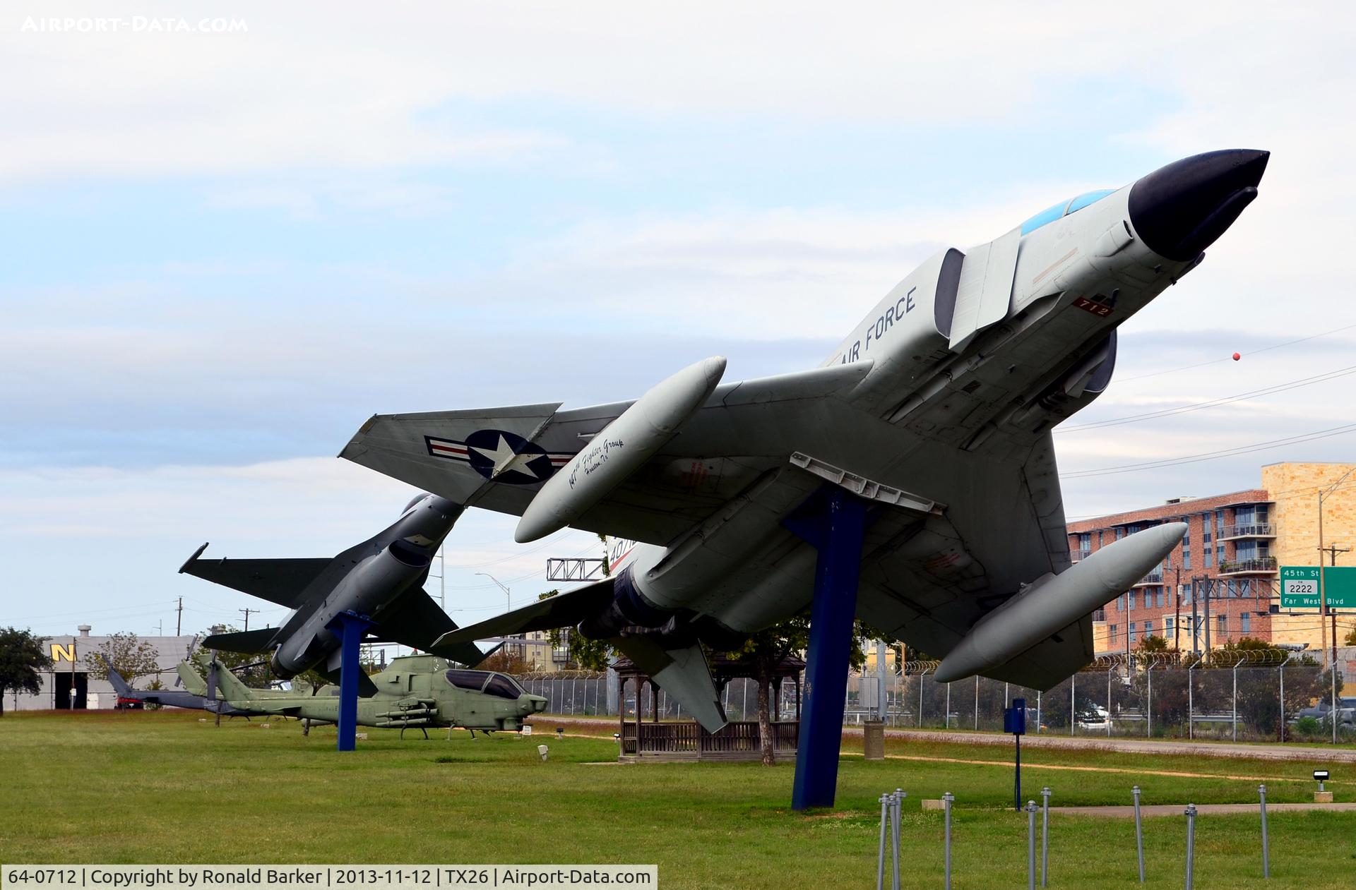 64-0712, 1964 McDonnell F-4C Phantom II C/N 969, F-4C with F-16C in background, Camp Mabry, TX