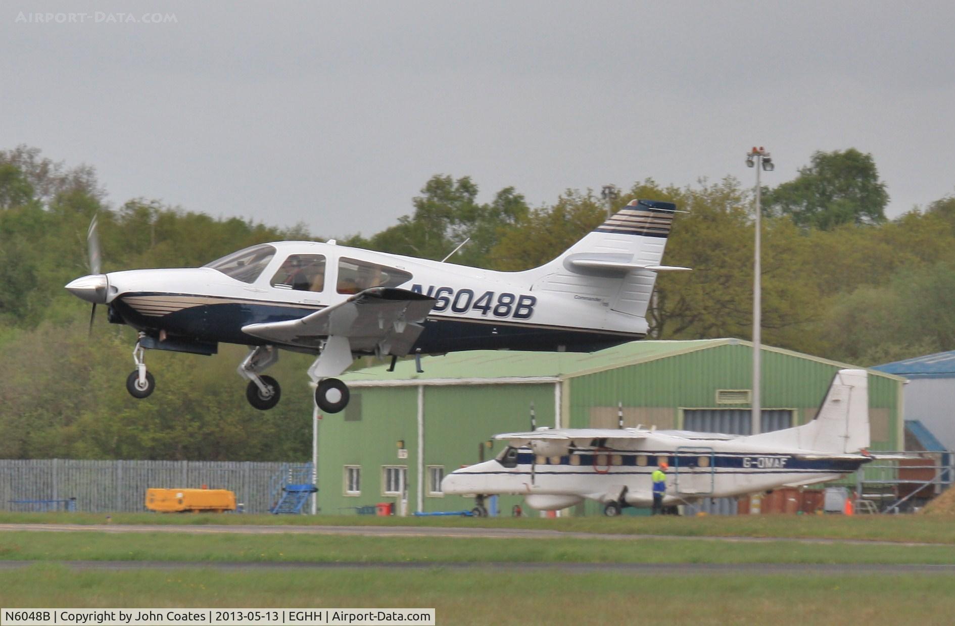 N6048B, 2000 Rockwell Commander 114B C/N 14676, Lifts off past Cobham