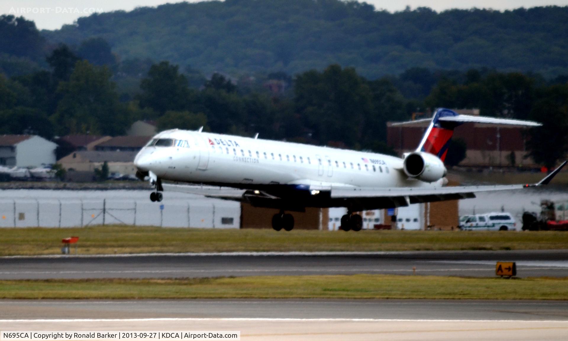 N695CA, 2006 Bombardier CRJ-900ER (CL-600-2D24) C/N 15097, Landing DCA