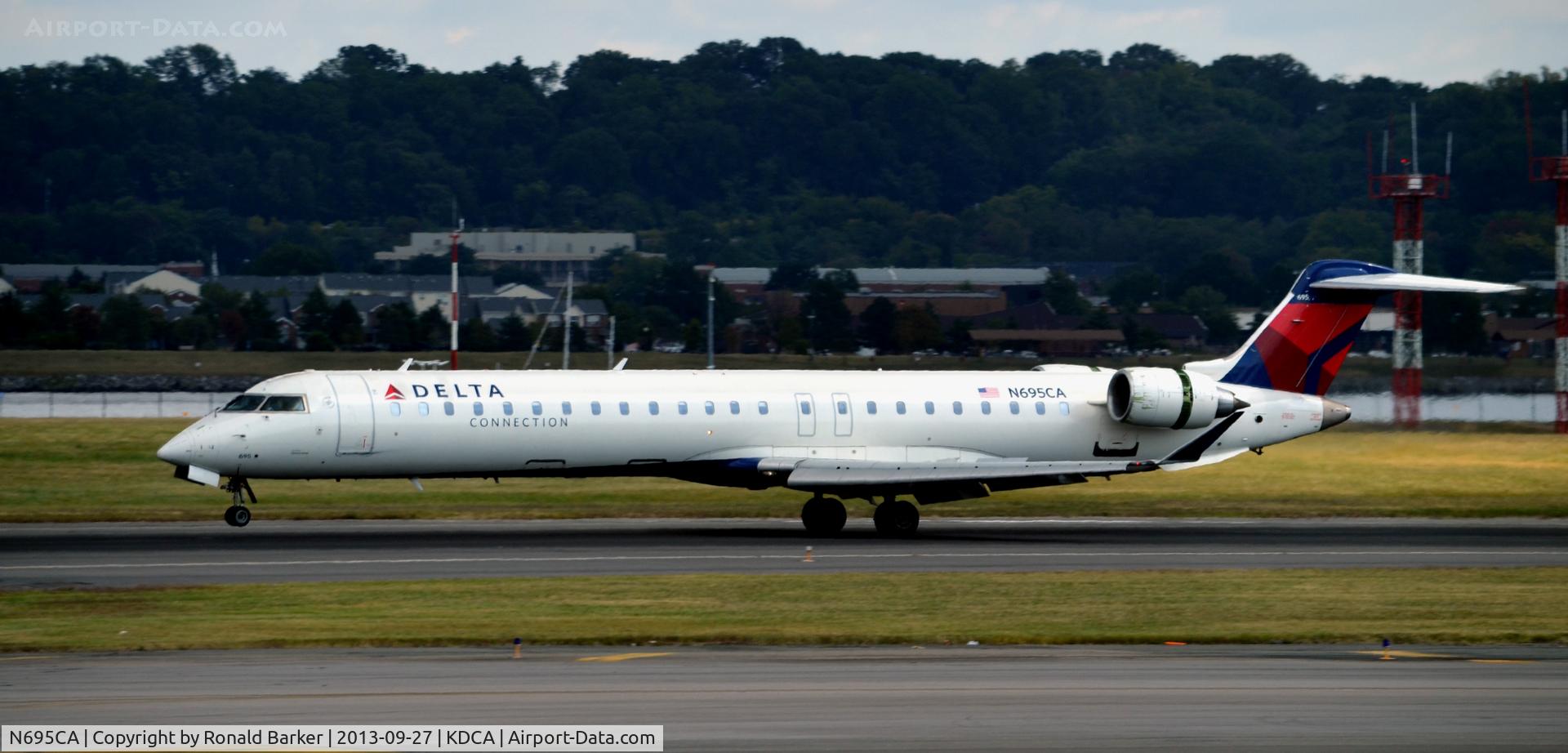 N695CA, 2006 Bombardier CRJ-900ER (CL-600-2D24) C/N 15097, Landing DCA