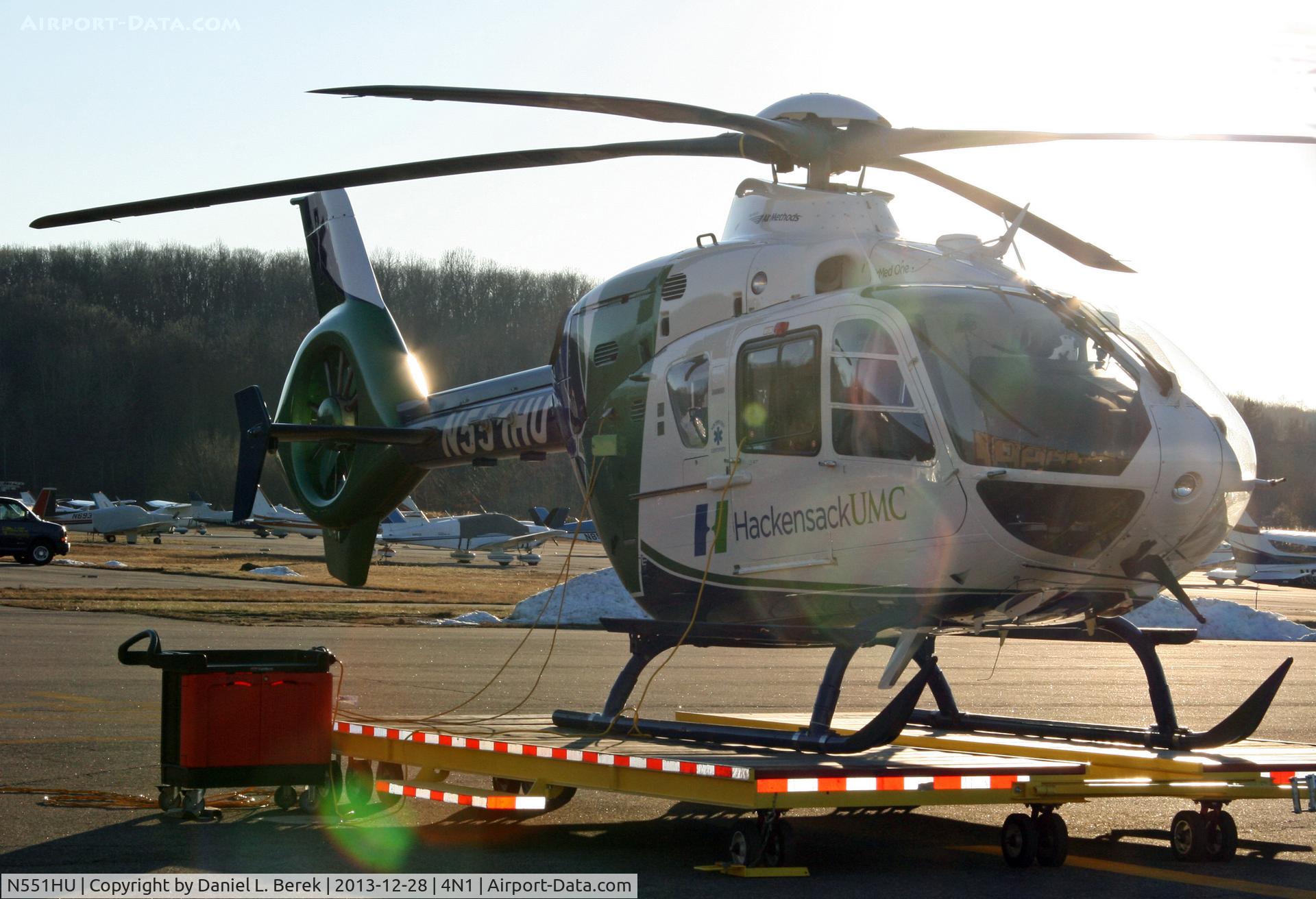 N551HU, 2006 Eurocopter EC-135P-2 C/N 0490, The late evening sunlight is almost blinding, making this interesting Medevac helicopter hard to see!