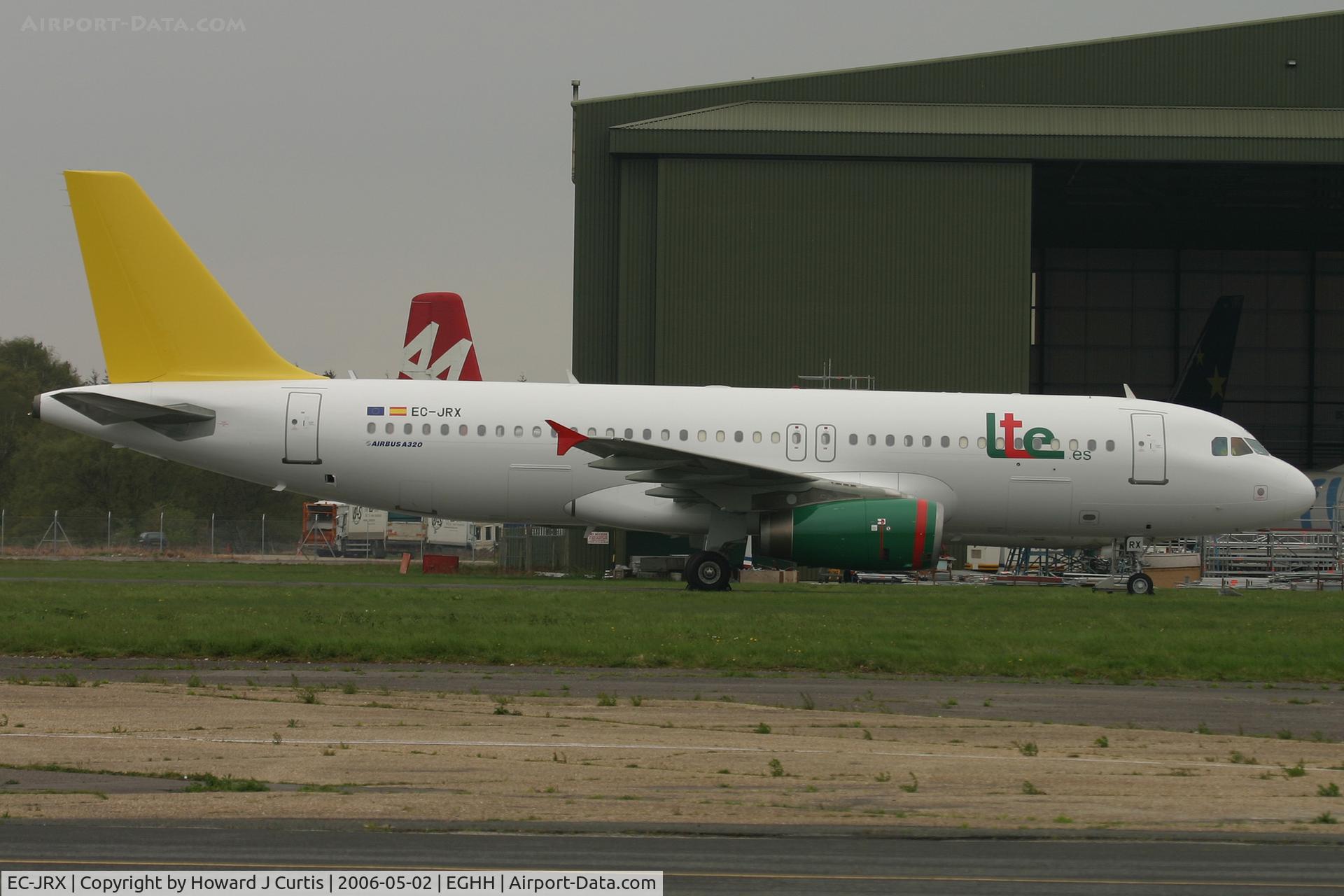 EC-JRX, 1996 Airbus A320-232 C/N 580, LTE.es, outside BASCOs with CL.44 9G-LCA behind. Inside the hangar is one of the short-lived flyBe 737s. 6000th aircraft photo on Airport-Data.com.