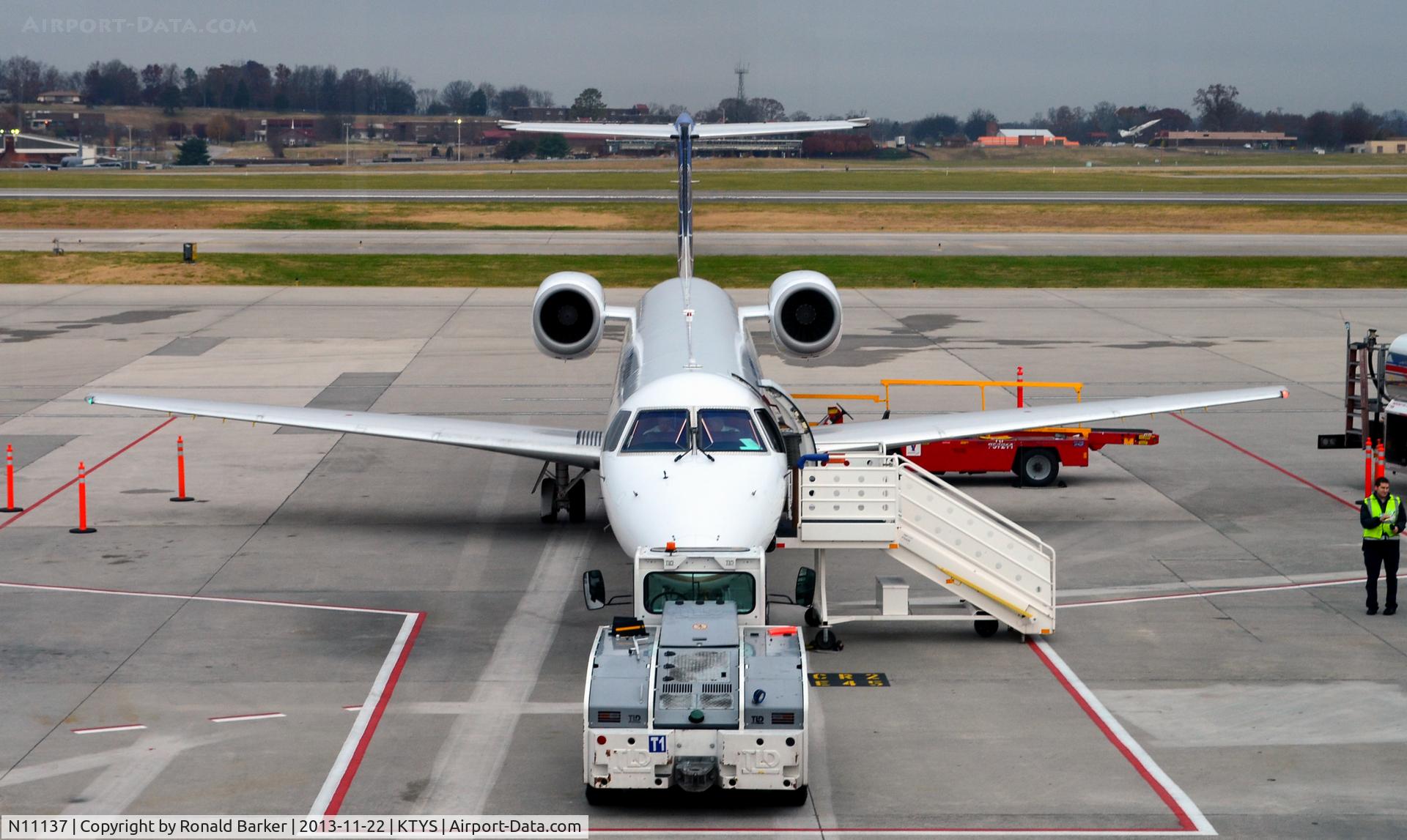 N11137, 2003 Embraer ERJ-145XR (EMB-145XR) C/N 145721, Gate 9  TYS