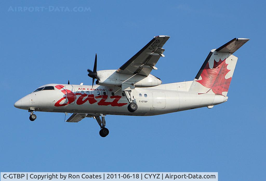 C-GTBP, 1987 De Havilland Canada DHC-8-102 Dash 8 C/N 066, 1987 Dehavilland Dash 8 landing at Toronto Int'l Airport.
