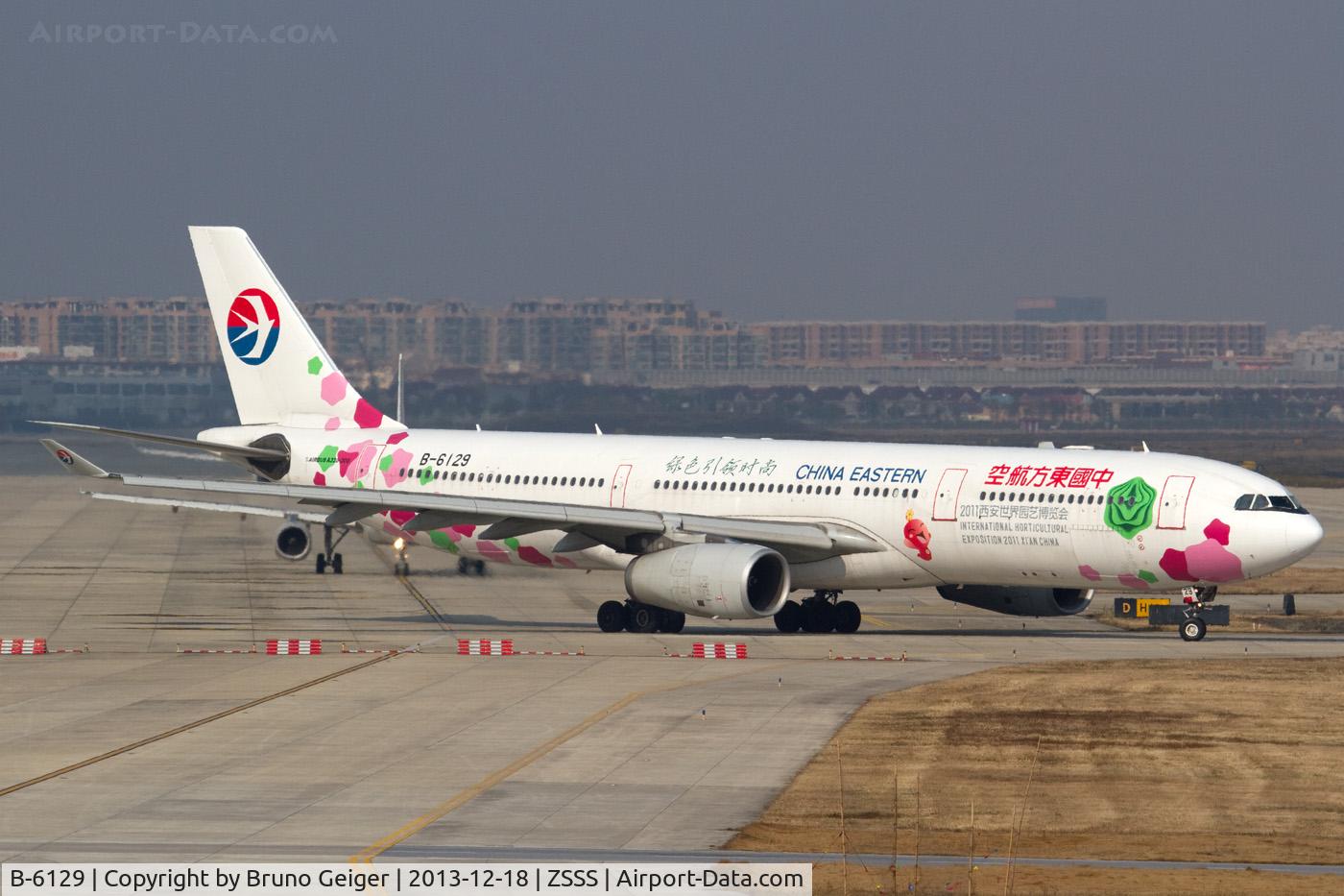 B-6129, 2006 Airbus A330-343X C/N 791, seen with 2011 Xian International Horticultural Exposition colors taxiing to runway 36L