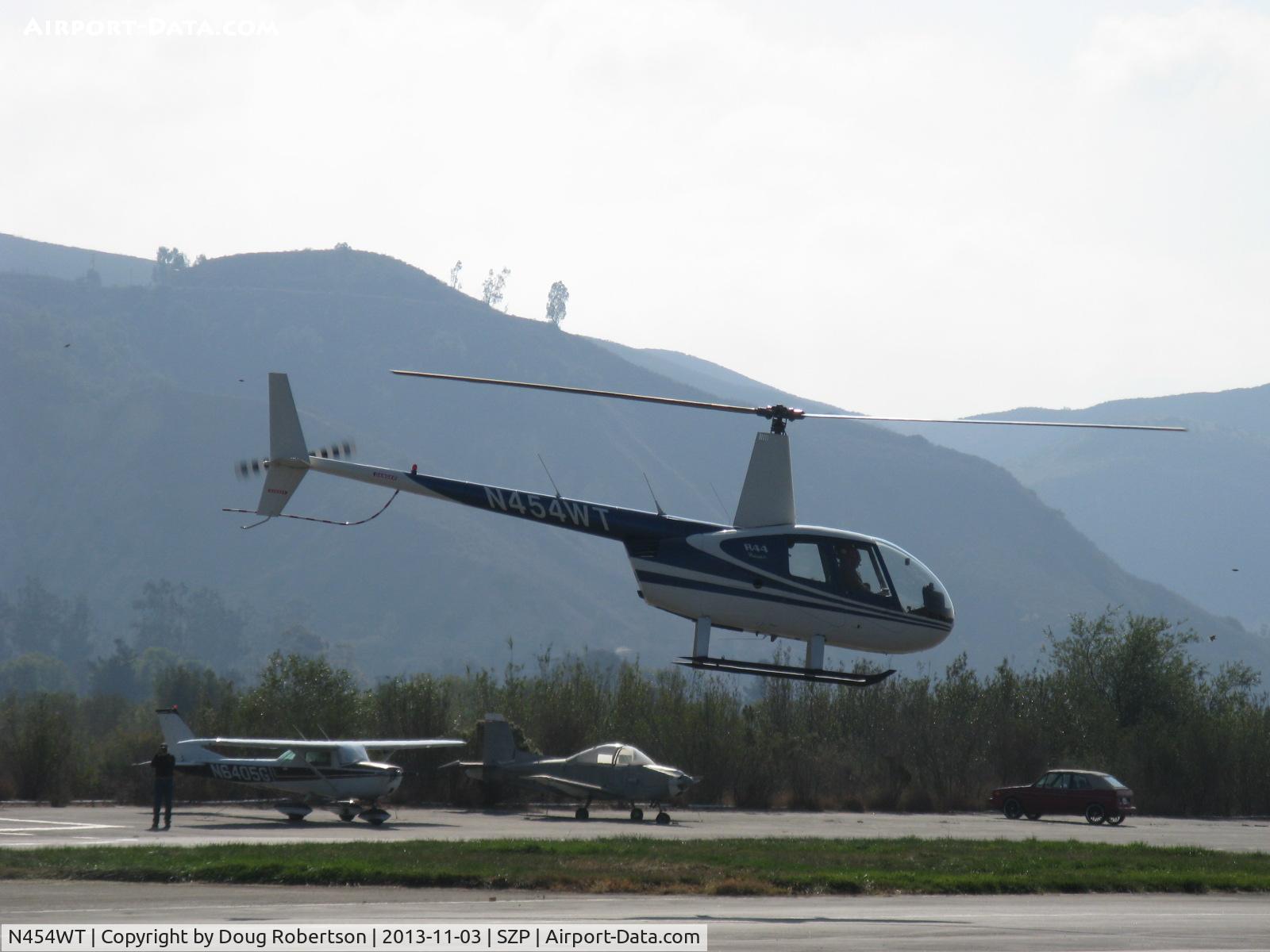 N454WT, 2001 Robinson R44 Raven II C/N 1042, 2001 Robinson R44 RAVEN, Lycoming O-540-F1B5 derated to 205 Hp continuous, departing SZP Helipad area for crossing Rwy 22