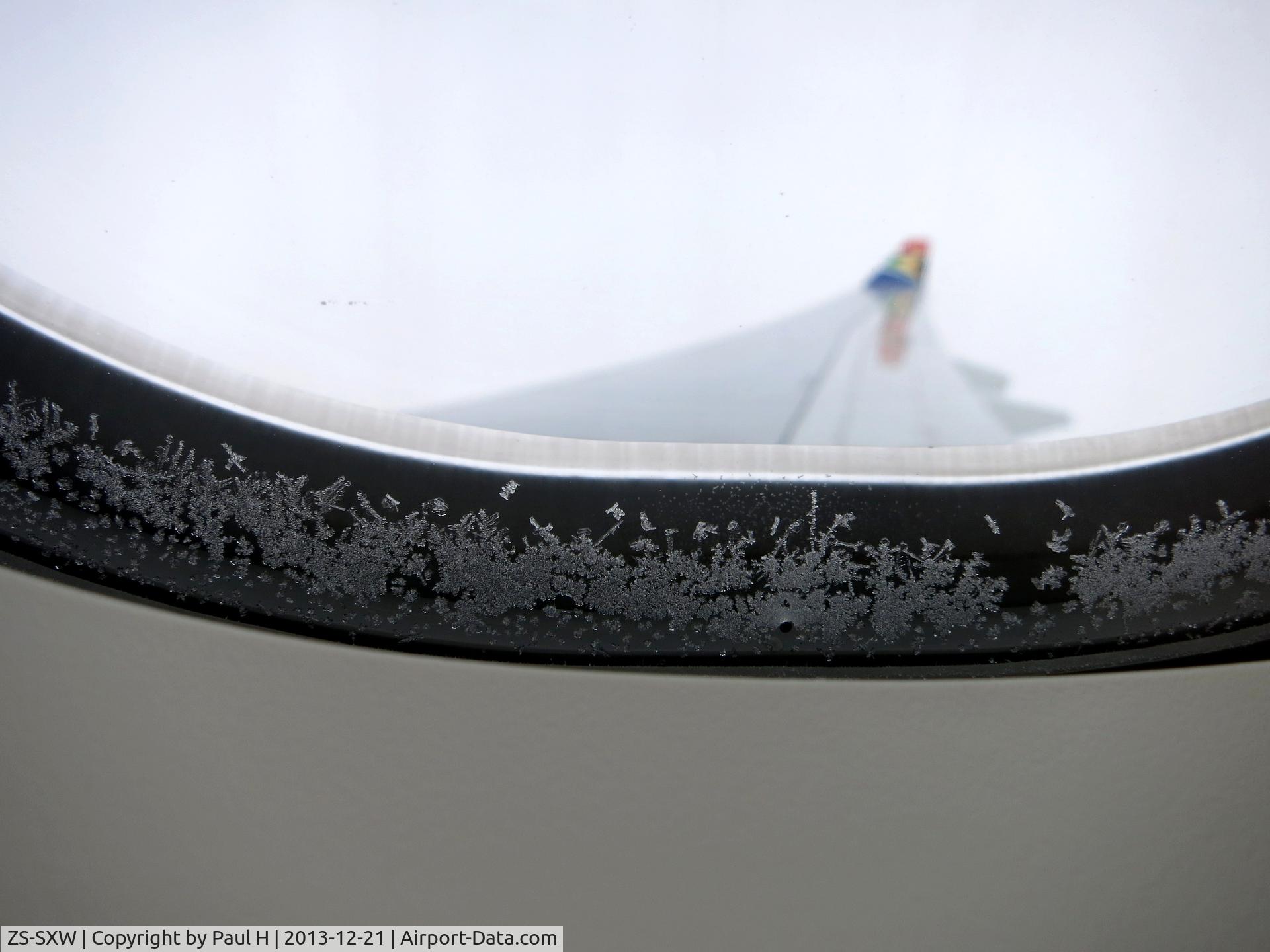 ZS-SXW, 2011 Airbus A330-243 C/N 1236, Ice on the window during flight