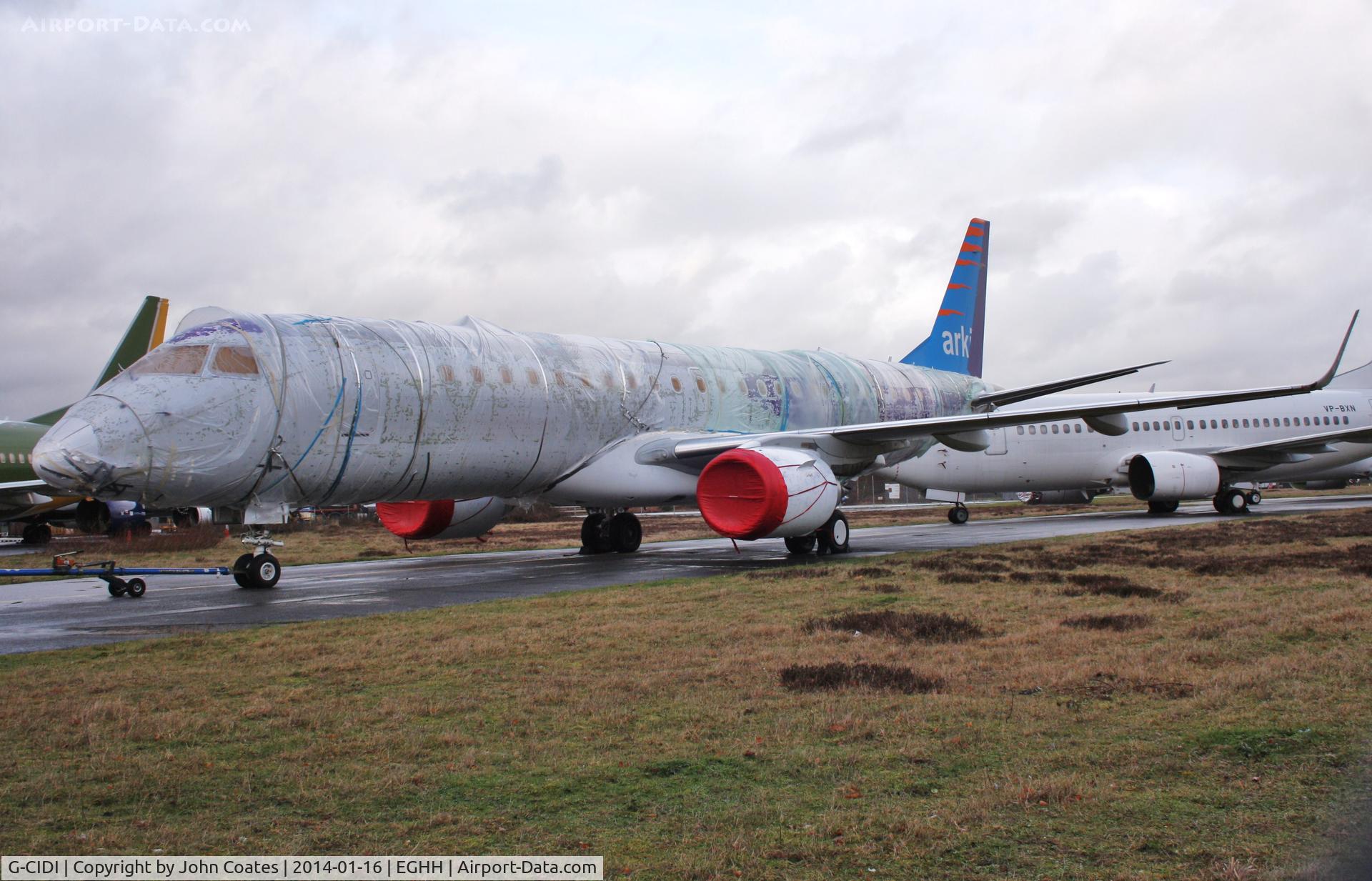 G-CIDI, 2013 Embraer 190LR (ERJ-190-100LR) C/N 19000616, Fully shrouded in polythene and about to re-enter paintshop for respray.