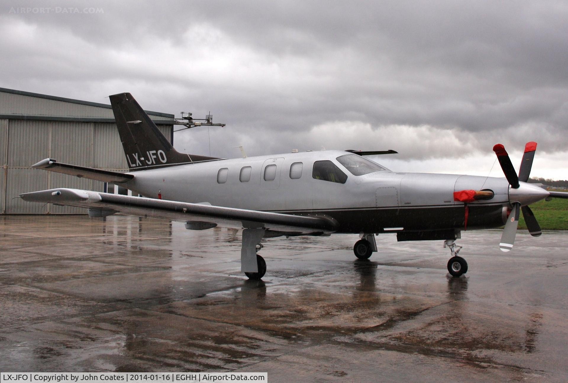 LX-JFO, 2007 Socata TBM-850 C/N 422, Sat in the rain at Pilatus Centre