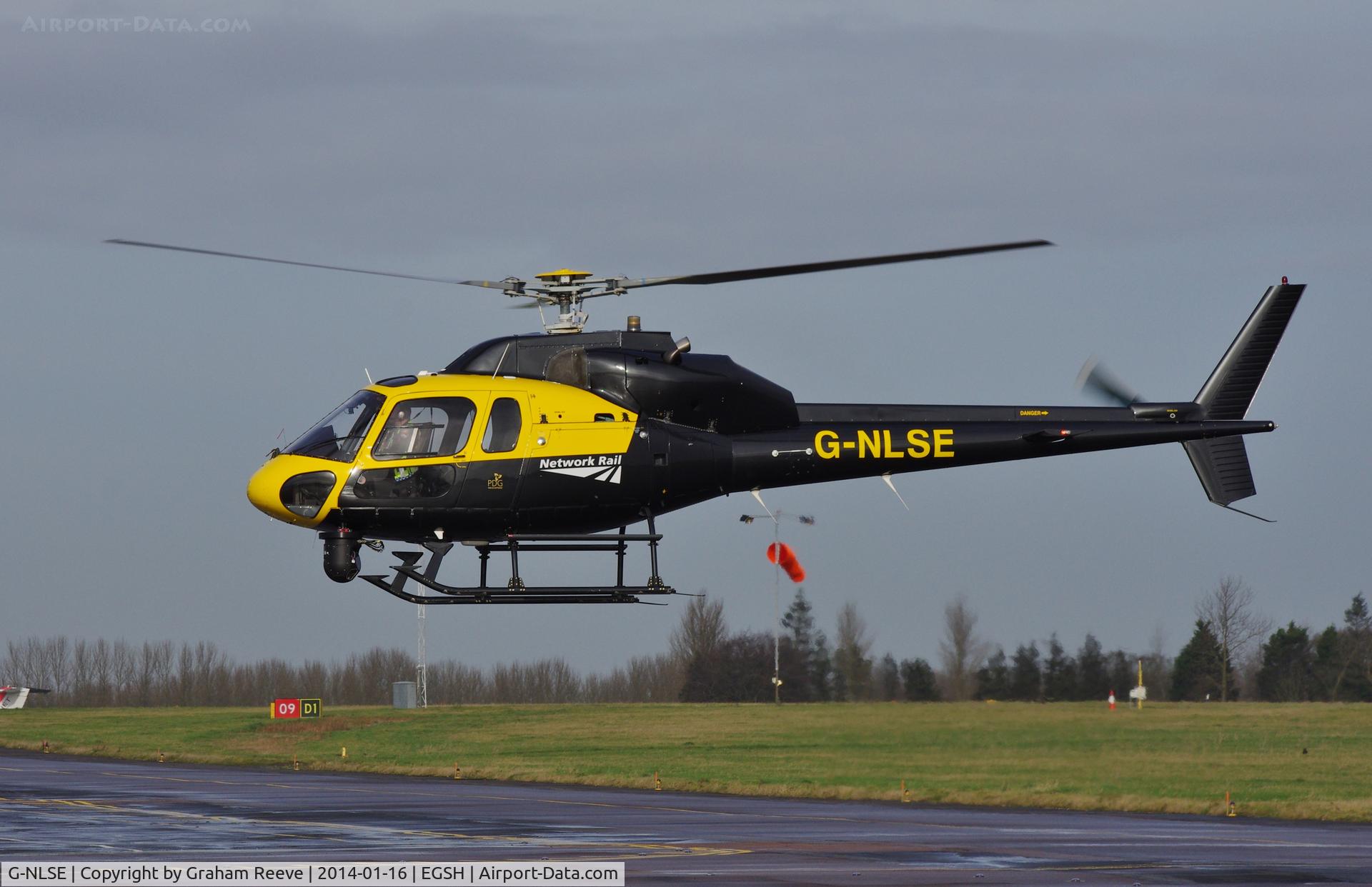 G-NLSE, 1987 Aerospatiale AS-355F-2 Ecureuil 2 C/N 5364, About to touch down.