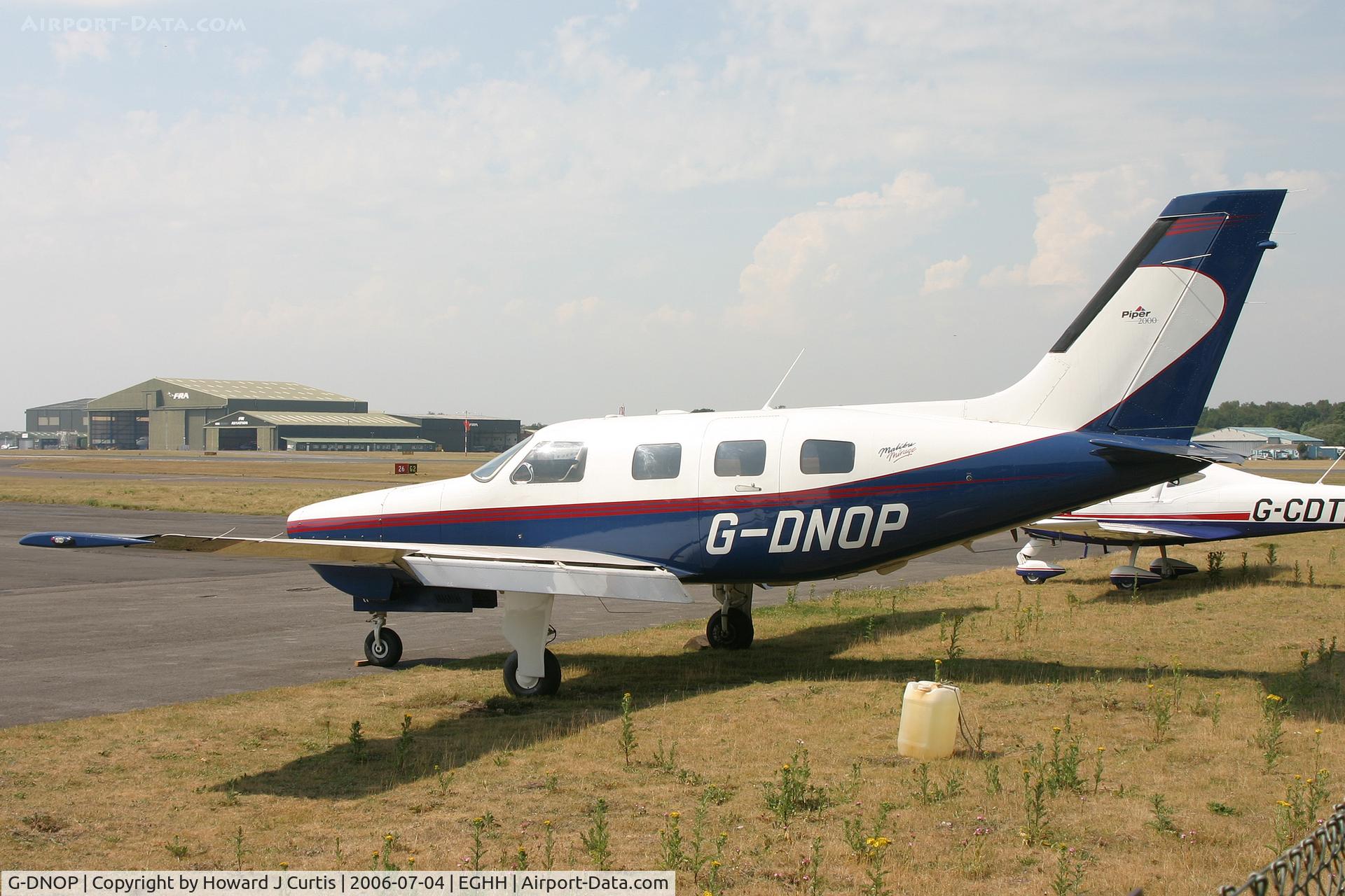 G-DNOP, 2000 Piper PA-46-350P Malibu Mirage C/N 4636303, Parked outside, minus engine.