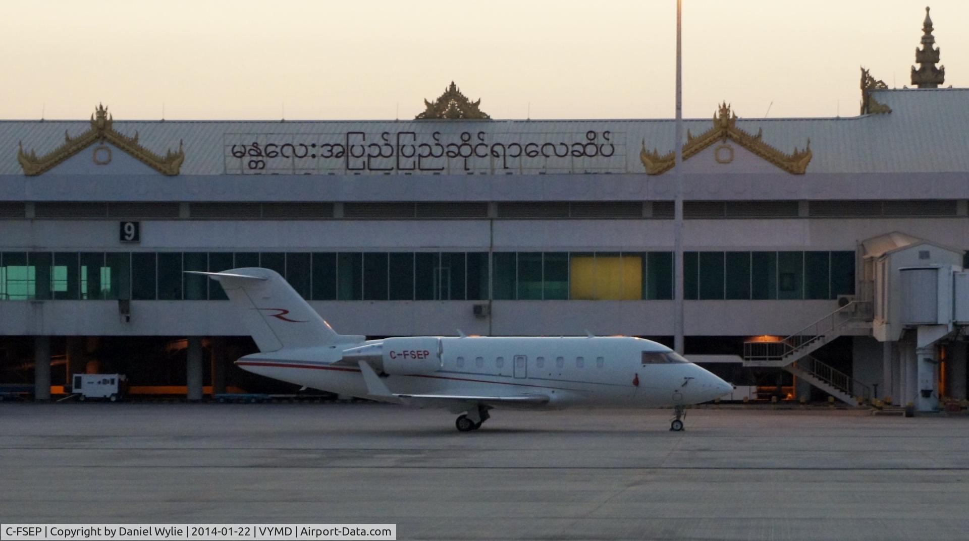 C-FSEP, 2010 Bombardier Challenger 605 (CL-600-2B16) C/N 5861, On tarmac at Mandalay, Myanmar (Burma) on January 22, 2014