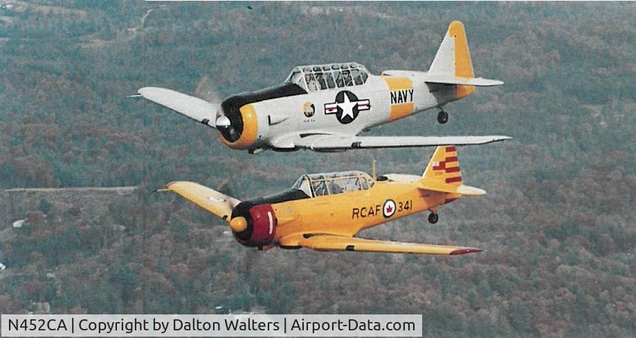 N452CA, 1952 Canadian Car & Foundry Harvard MK IV C/N CCF4-132, Flying in formation with N3685F over western NC - early 1990s.