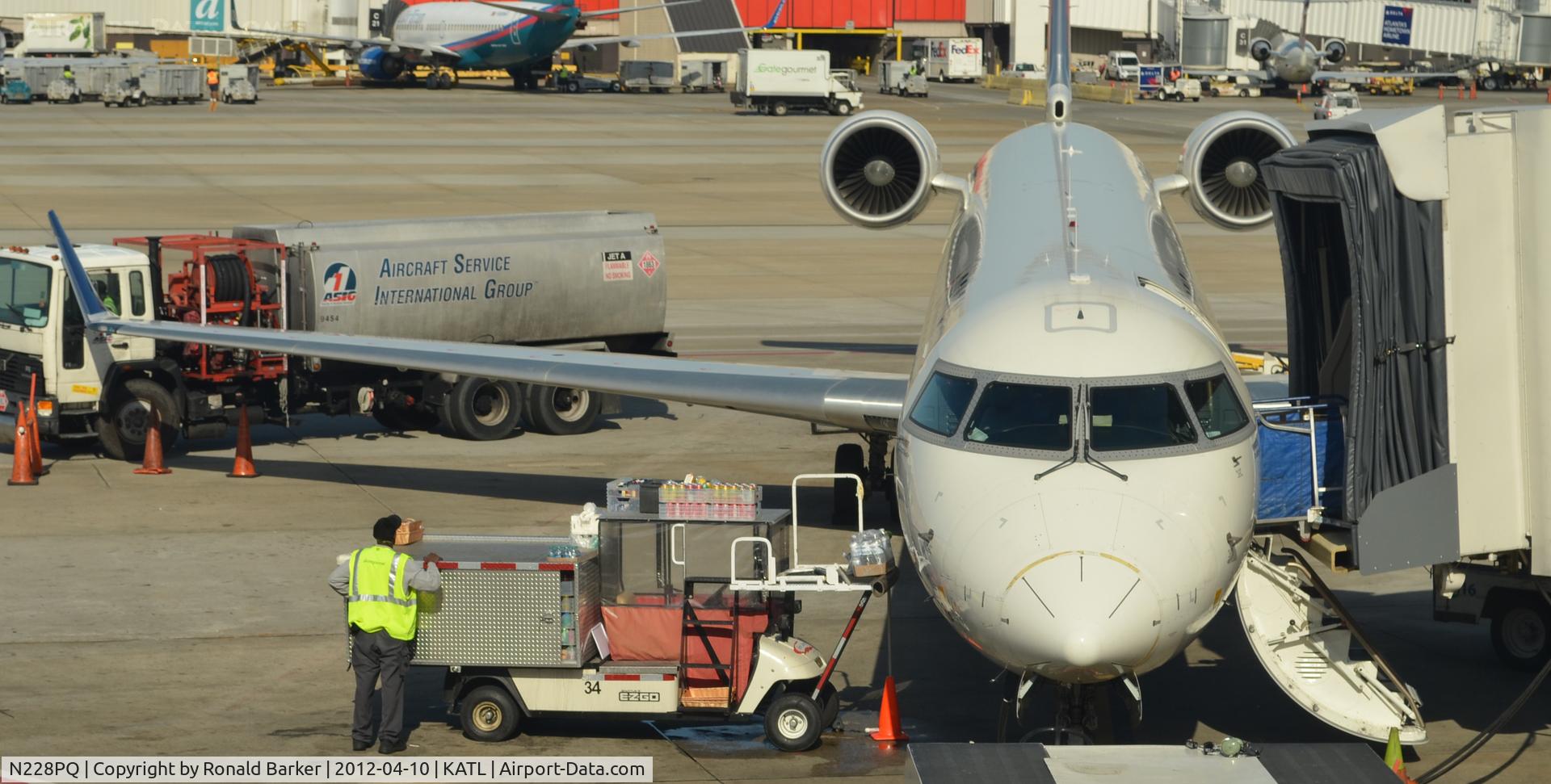 N228PQ, 2009 Bombardier CRJ-900ER (CL-600-2D24) C/N 15228, Fleet number 15228 being serviced Atlanta