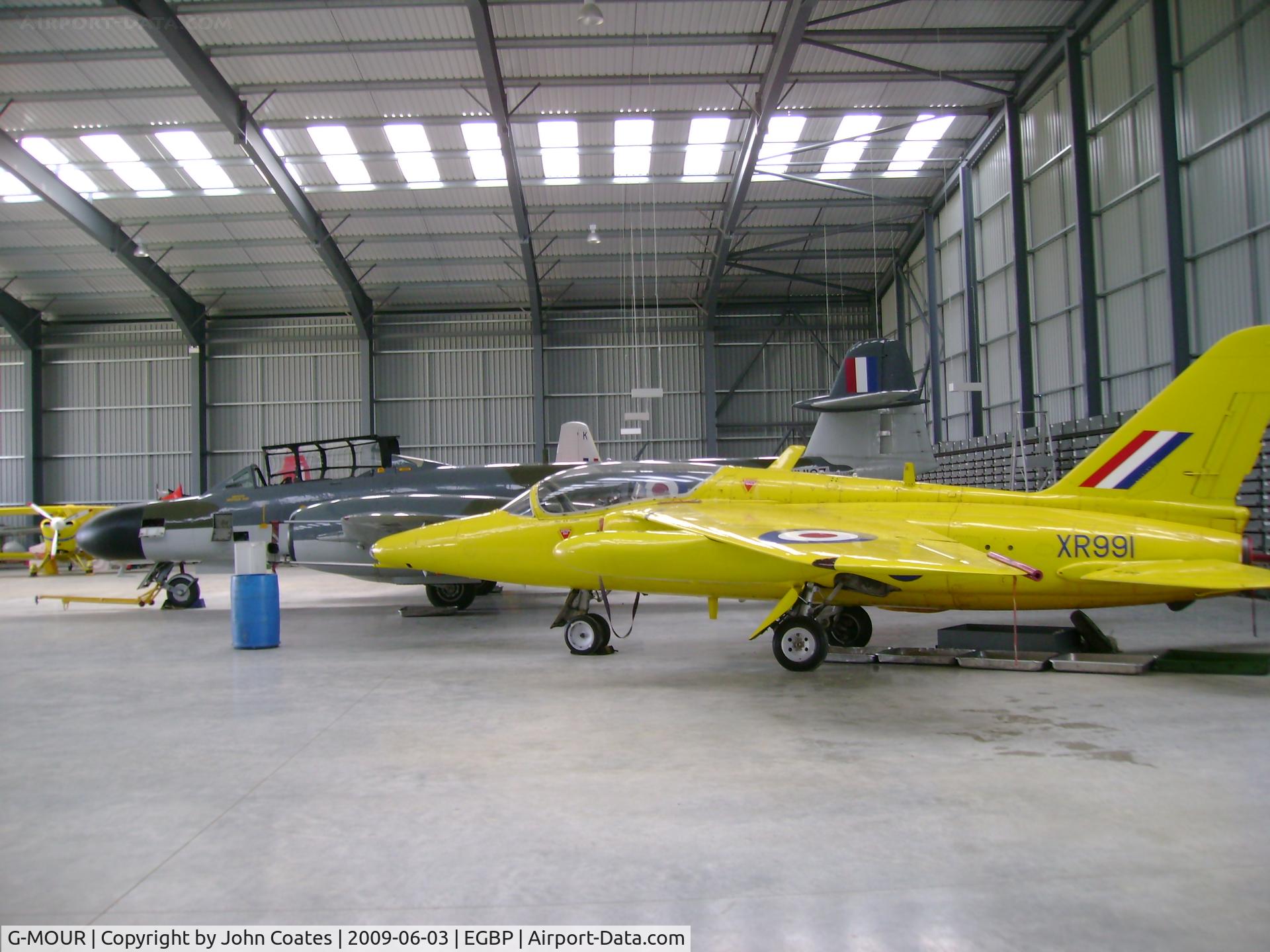 G-MOUR, 1964 Hawker Siddeley Gnat T.1 C/N FL596, In Delta Jets hangar next to Air Atlantique Meteor NF11 WM167