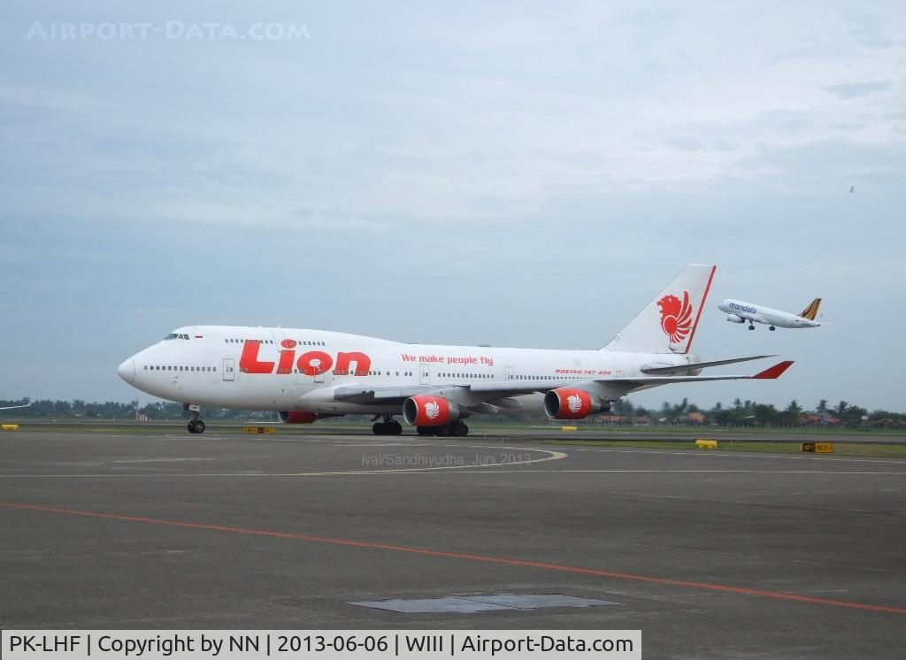 PK-LHF, 1989 Boeing 747-412 C/N 24063, Aircrafts queue on taxiway at SOEKARNO-HATTA International Airport Jakarta. In 2012 / 2013 CGK has ranked 9th bussiest airport in the world (link : http://www.world-airport-codes.com/world-top-30-airports.html  )