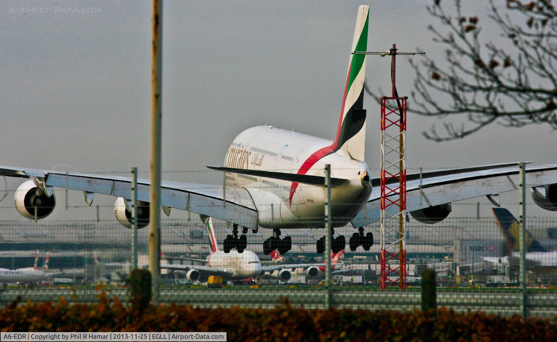 A6-EDR, 2011 Airbus A380-861 C/N 083, Emirates Airlines, (A6-EDR) 2011 Airbus A380-861, c/n 083, on approach to land on 27L with another (A6-EEA) pushing to take off on 27R Heathrow. © PhilRHama