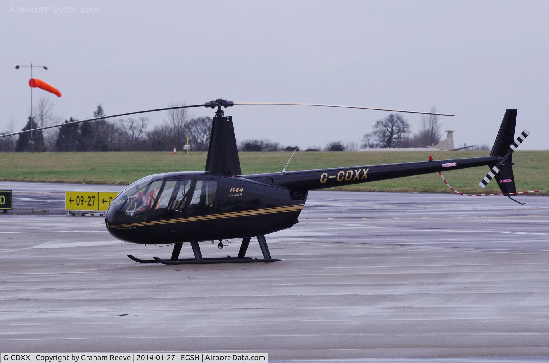 G-CDXX, 2005 Robinson R44 Raven II C/N 10624, Parked at Norwich.