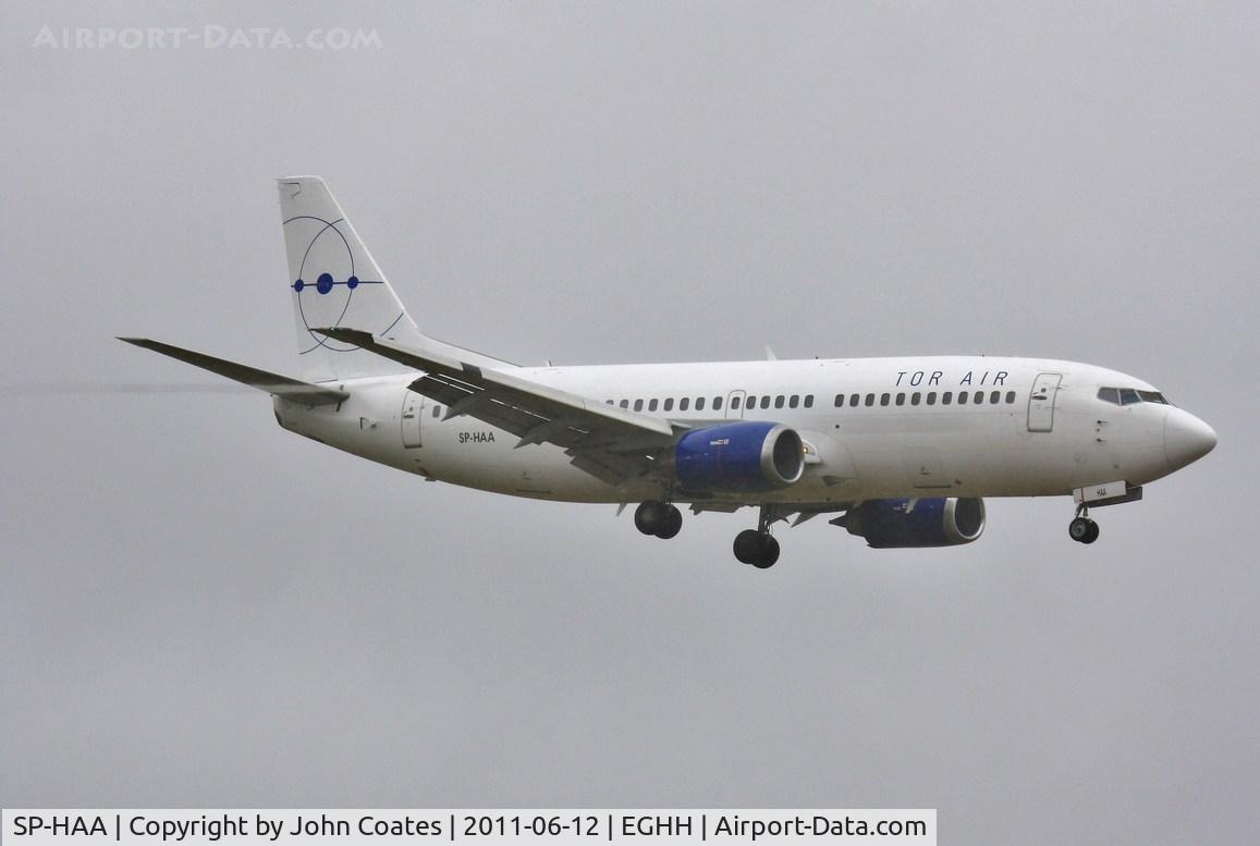 SP-HAA, 1990 Boeing 737-322 C/N 24664, About to land in wet and windy weather