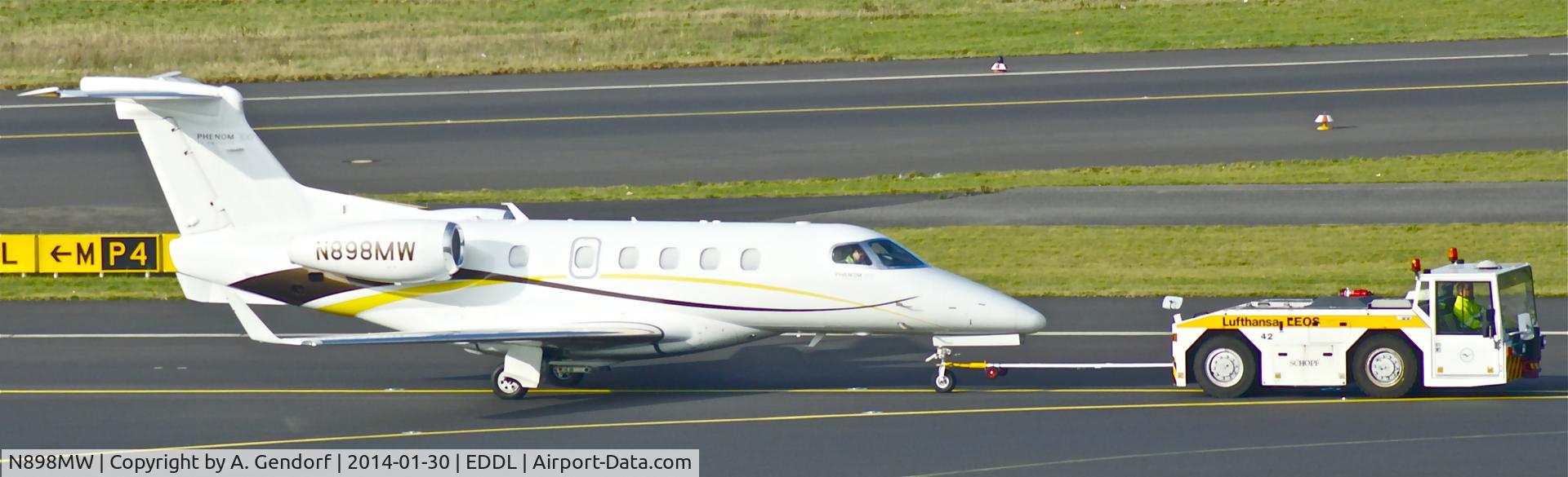 N898MW, 2011 Embraer EMB-505 Phenom 300 C/N 50500048, Privat (untitled), is here under tow on taxiway 