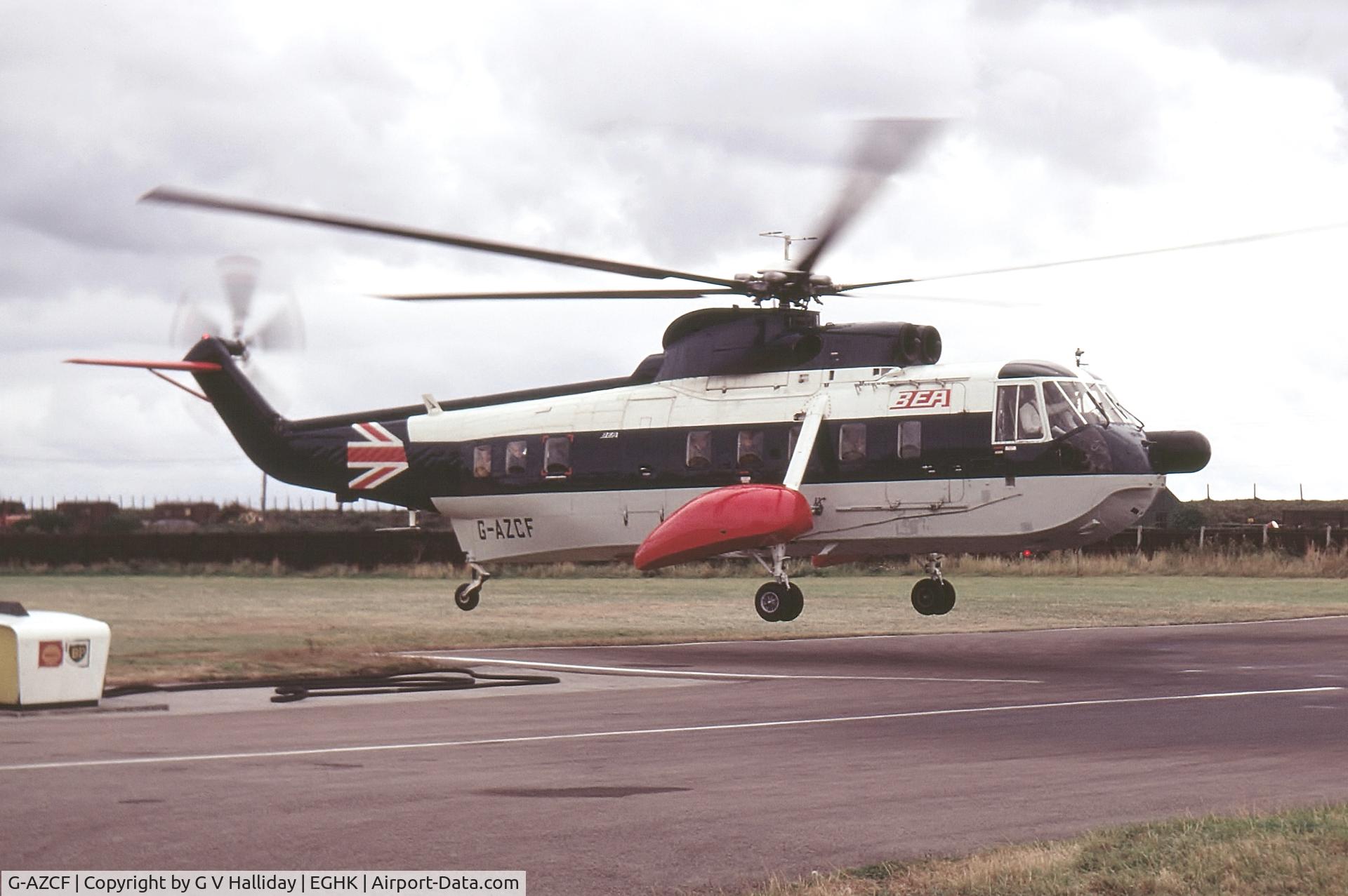 G-AZCF, 1971 Sikorsky S-61N C/N 61488, Landing after a flight from Scilly Isles.  There were few restrictions airside in those days as this photograph shows.  It was taken on a Konica Compact camera using 35mm Kodachrome slide film and scanned  February 2014.