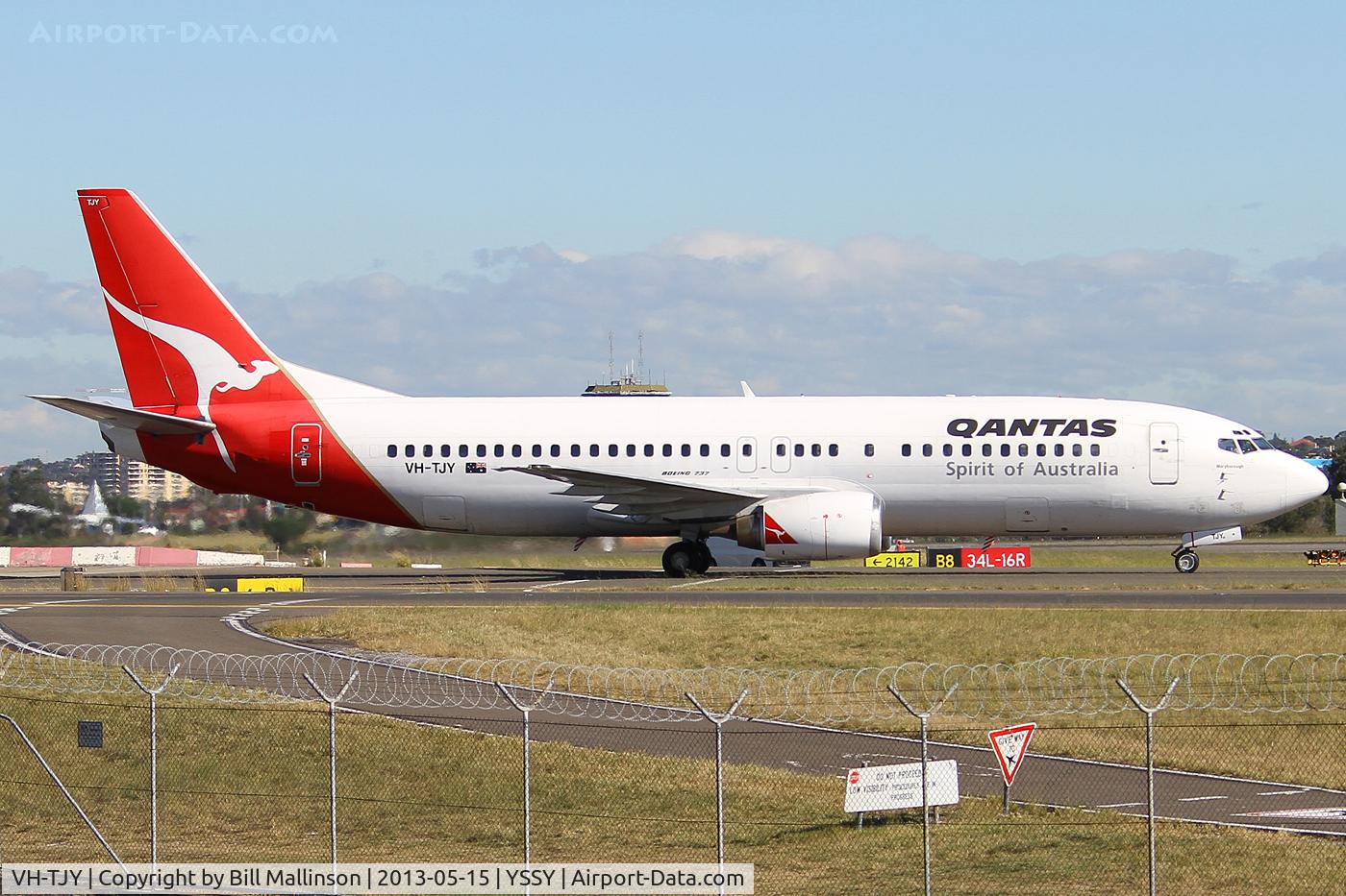 VH-TJY, 1996 Boeing 737-476 C/N 28151, TAXIING FROM 34L