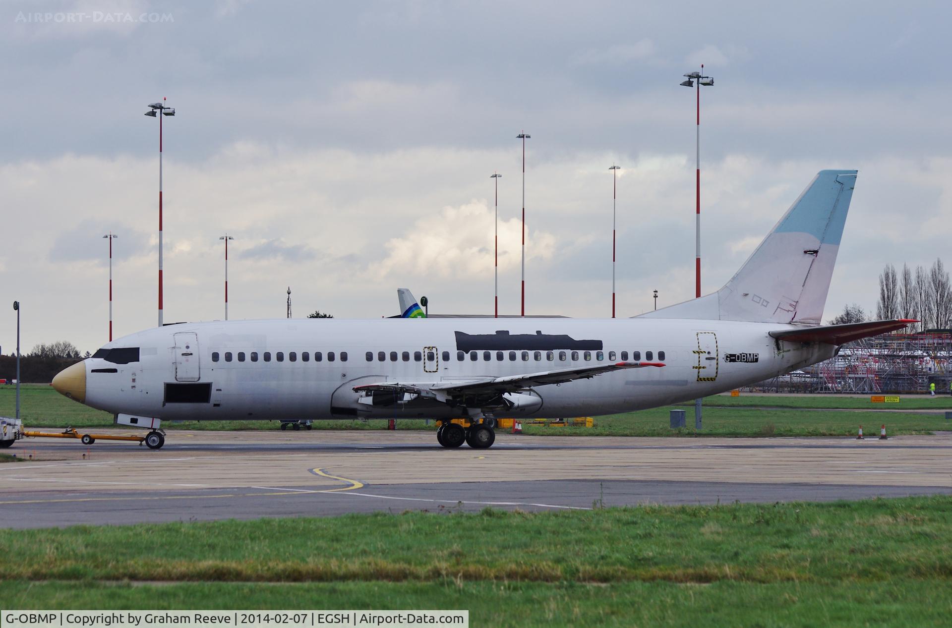 G-OBMP, 1992 Boeing 737-3Q8 C/N 24963, Looking in a sorry state and under tow.