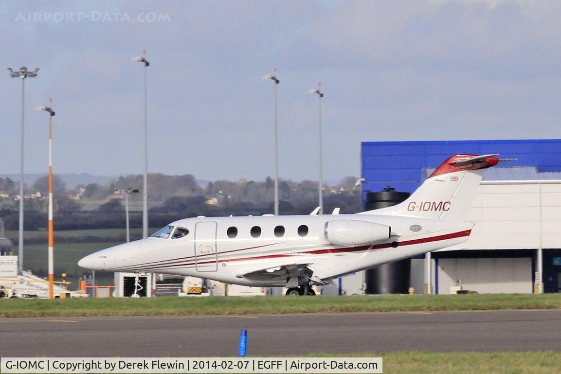 G-IOMC, 2007 Raytheon 390 Premier IA C/N RB-209, Raytheon Premier 1A, out of Liverpool, seen taxxing to the Cambrian apron at EGFF.