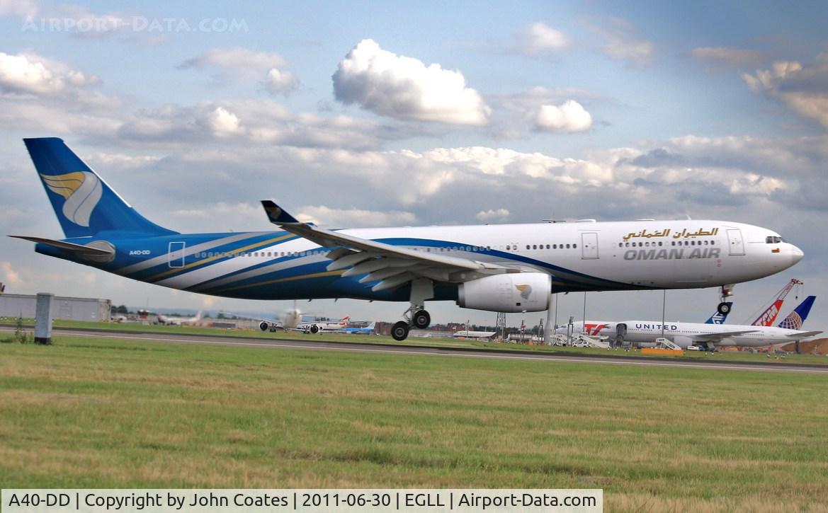 A40-DD, 2009 Airbus A330-343X C/N 1063, Evening arrival touching down 27R