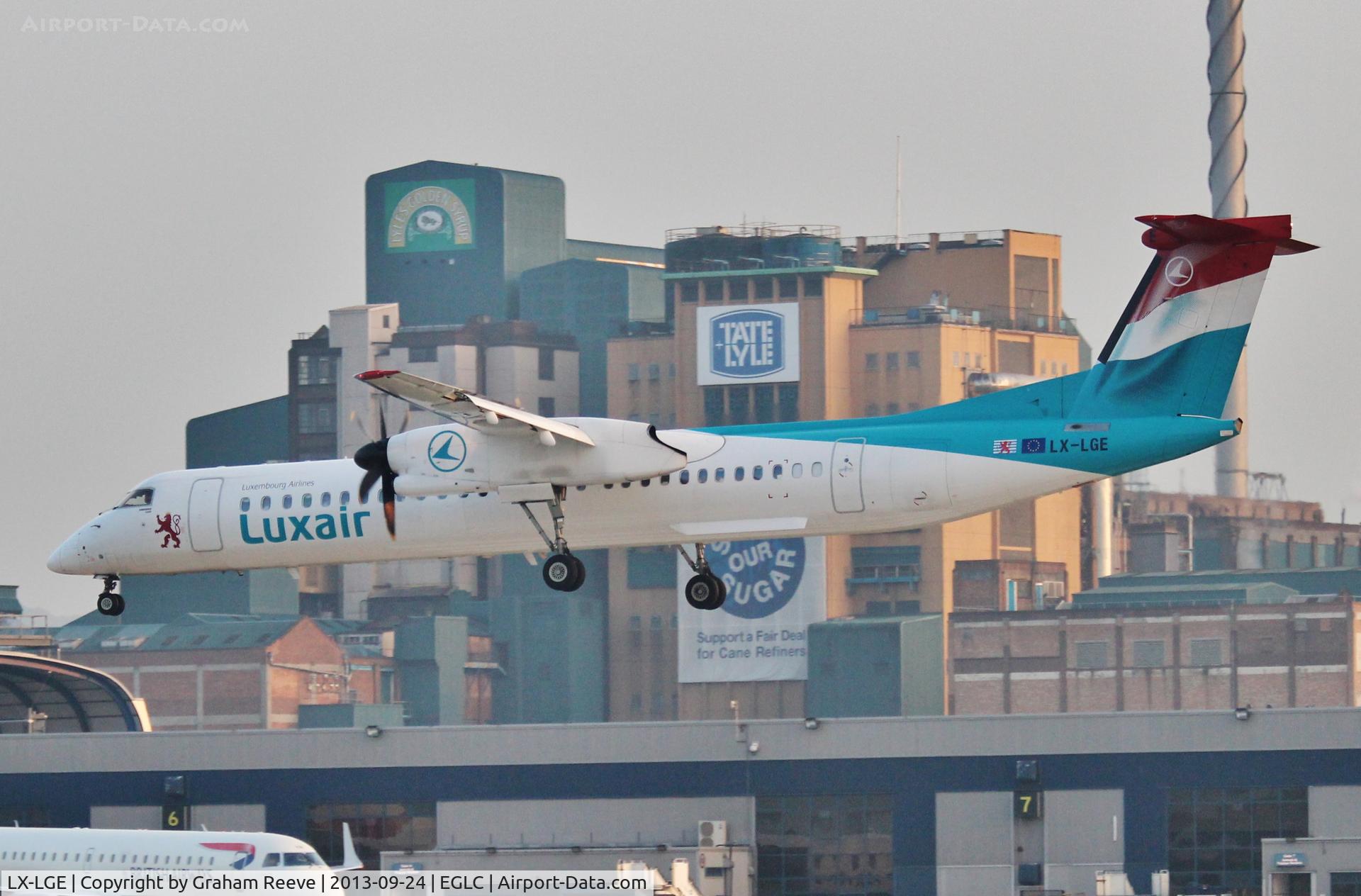 LX-LGE, 2009 De Havilland Canada DHC-8-402Q Dash 8 C/N 4284, Landing in the late afternoon sun.