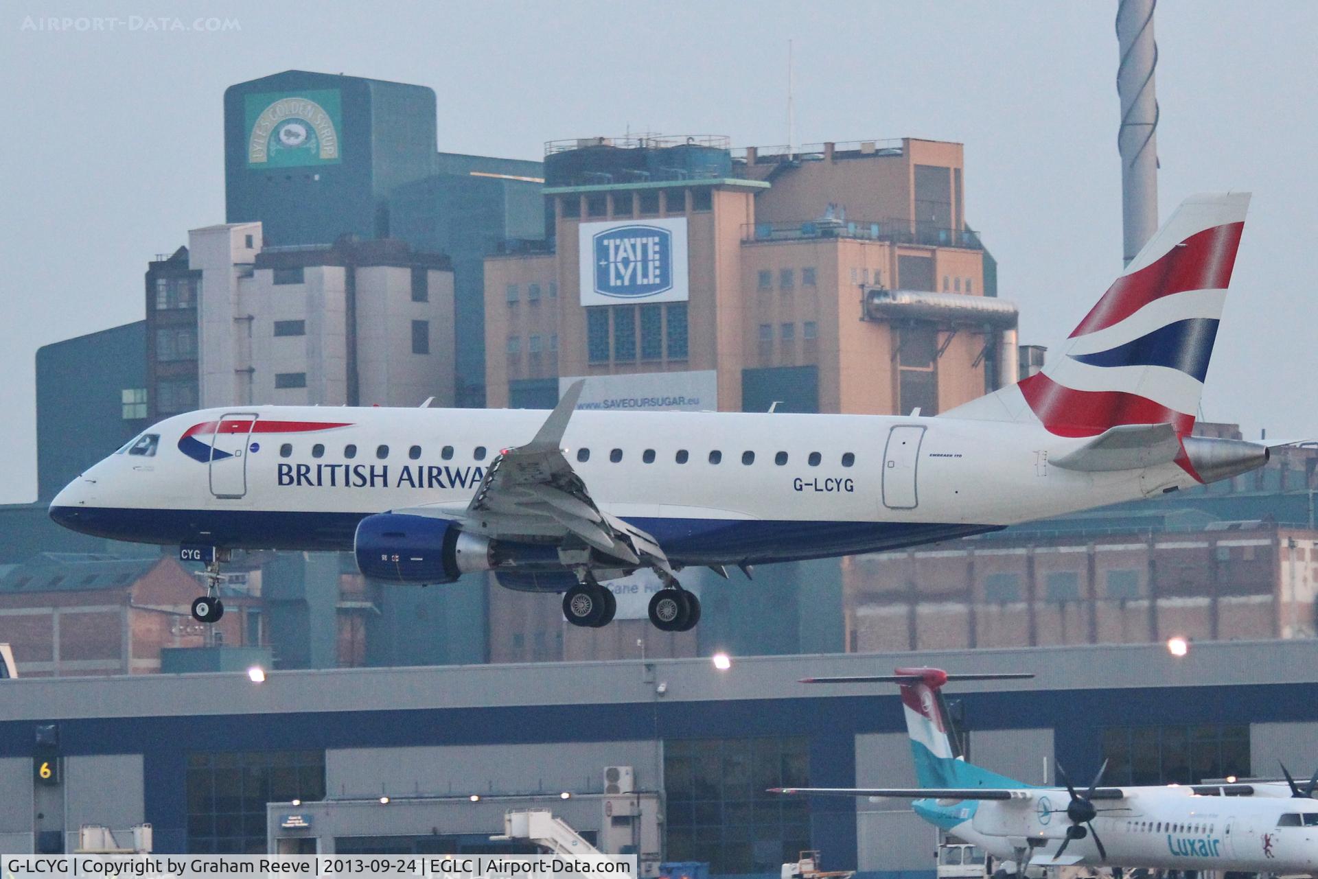 G-LCYG, 2009 Embraer 170STD (ERJ-170-100STD) C/N 17000300, Landing in the early evening twilight.
